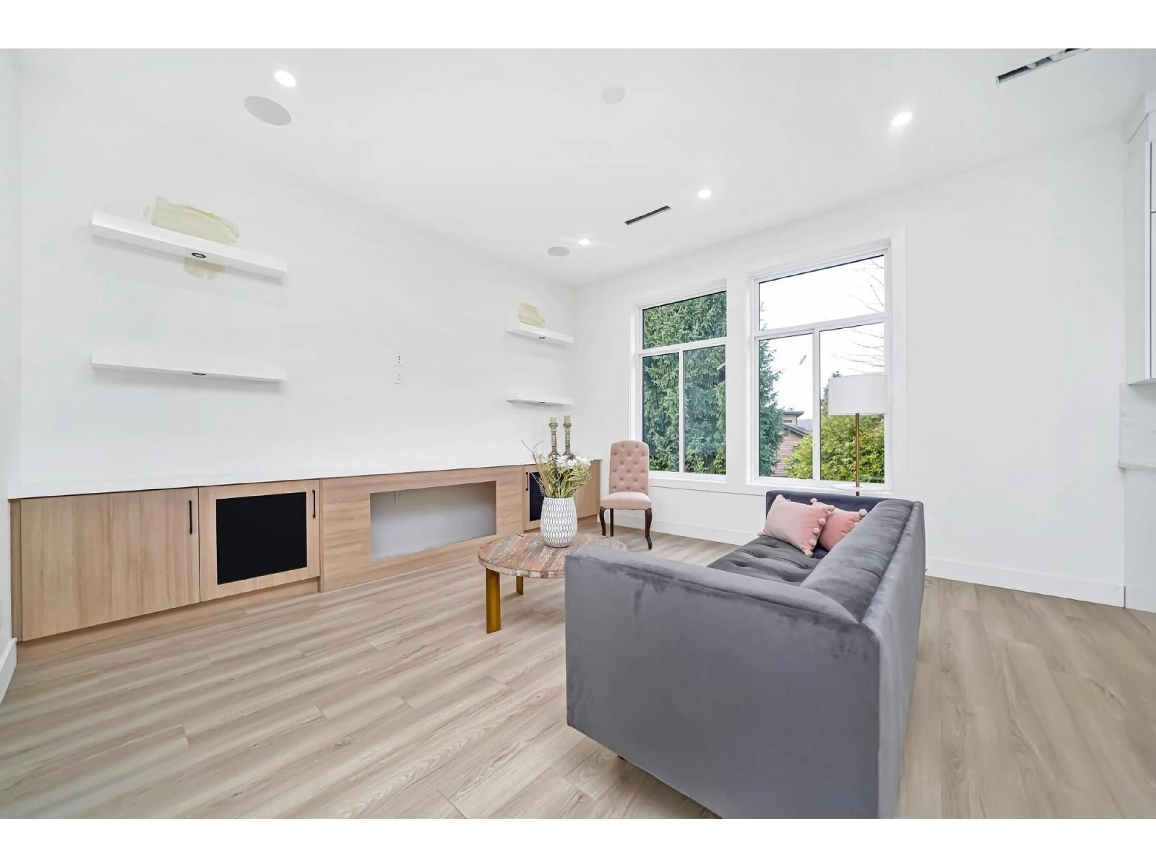 Living room with furniture, wood/laminate floor for 5839 185A STREET, Surrey British Columbia V3S7H3