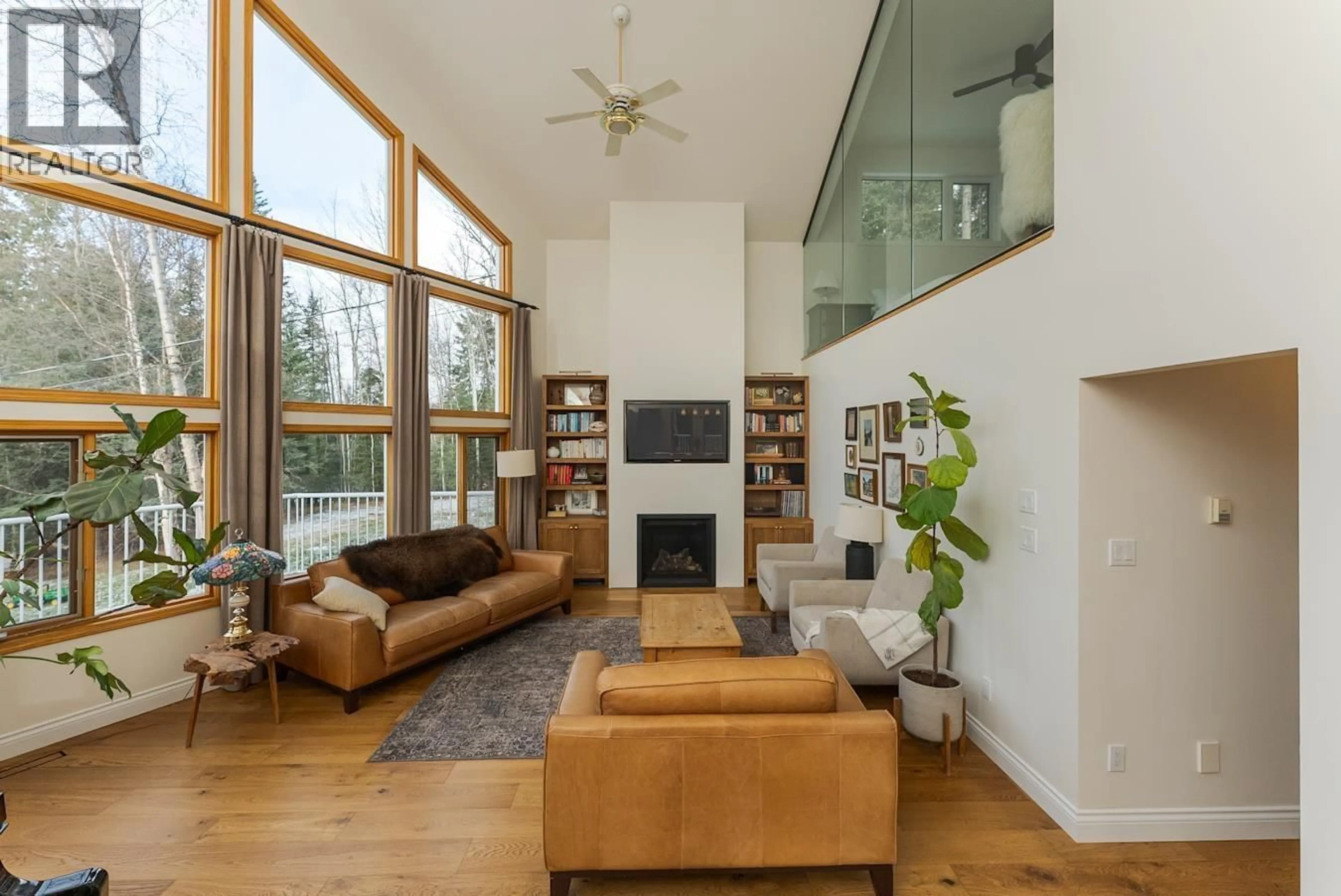 Living room with furniture, wood/laminate floor for 23830 WEST LAKE ROAD, Prince George British Columbia V2N6H6