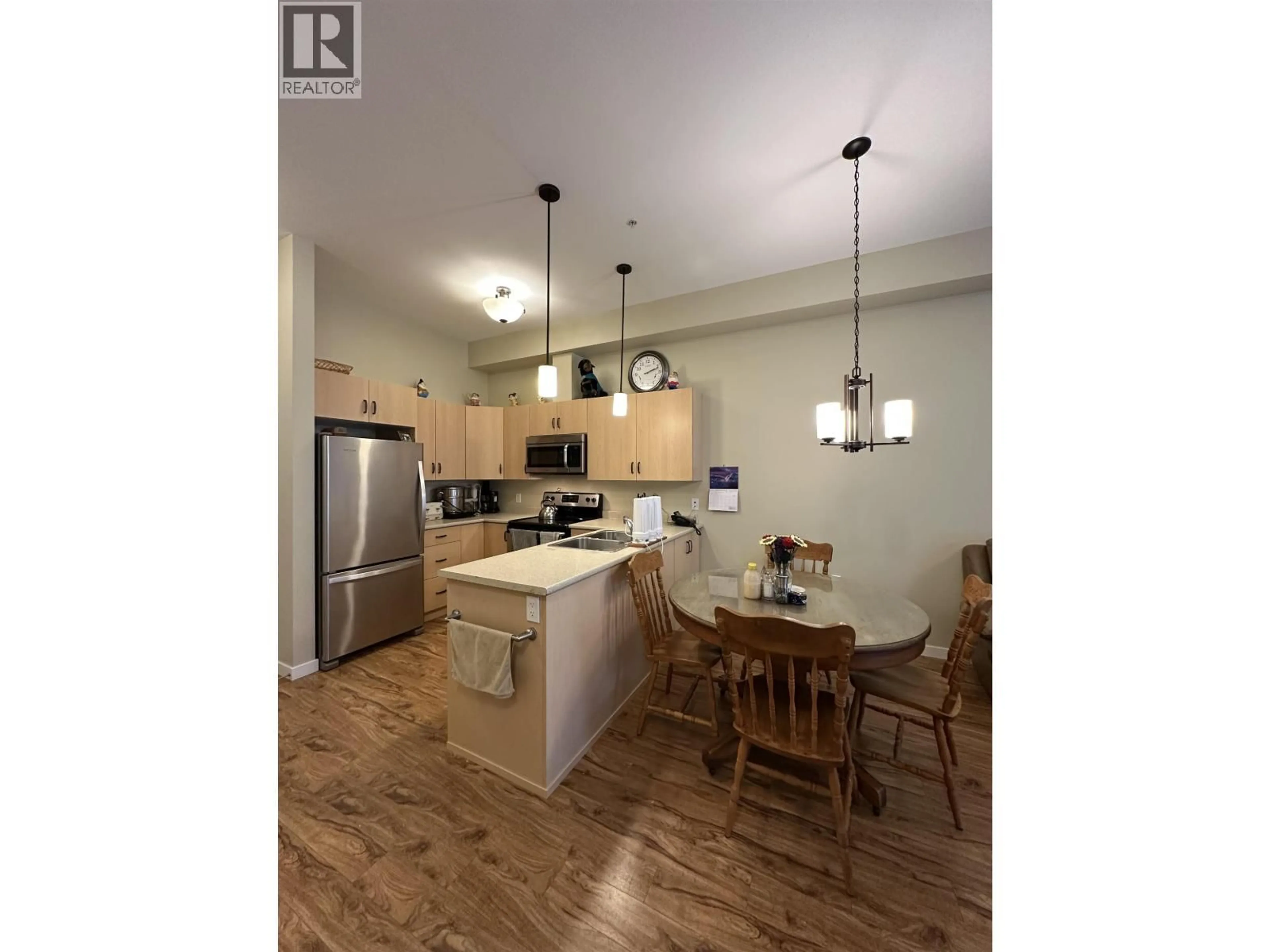 Open concept kitchen, wood/laminate floor for 115 - 1444 20TH AVENUE, Prince George British Columbia V2L0C9