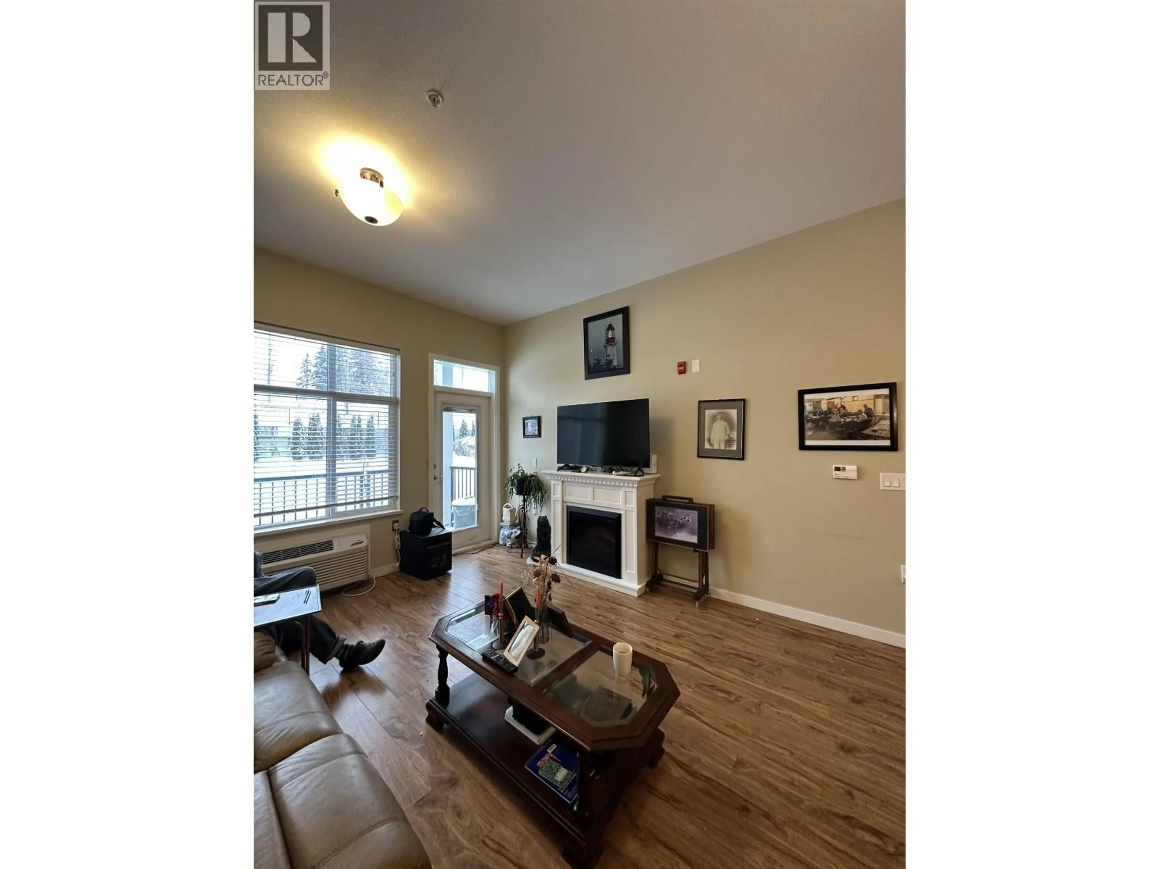 Living room with furniture, wood/laminate floor for 115 - 1444 20TH AVENUE, Prince George British Columbia V2L0C9