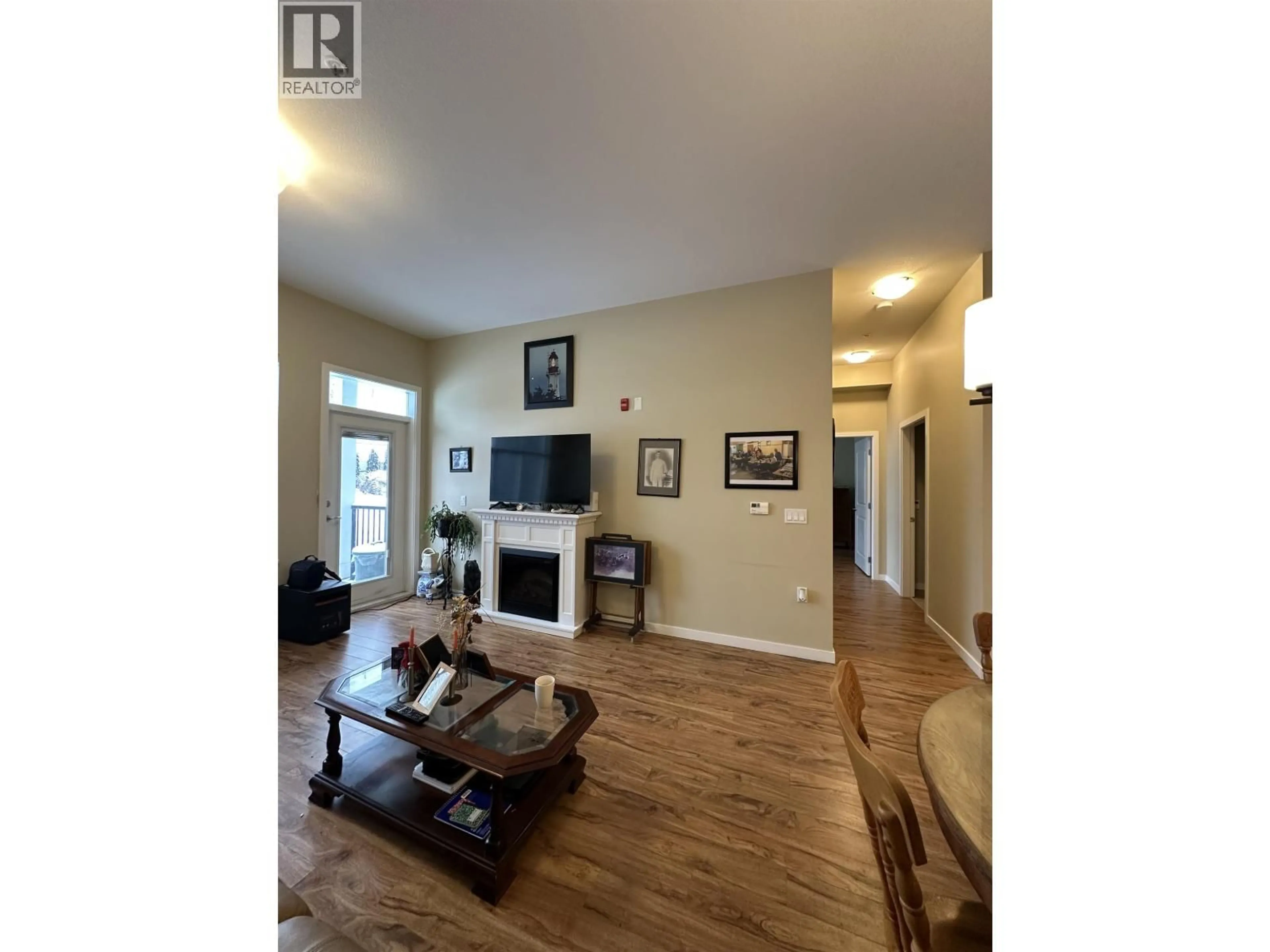 Living room with furniture, wood/laminate floor for 115 - 1444 20TH AVENUE, Prince George British Columbia V2L0C9