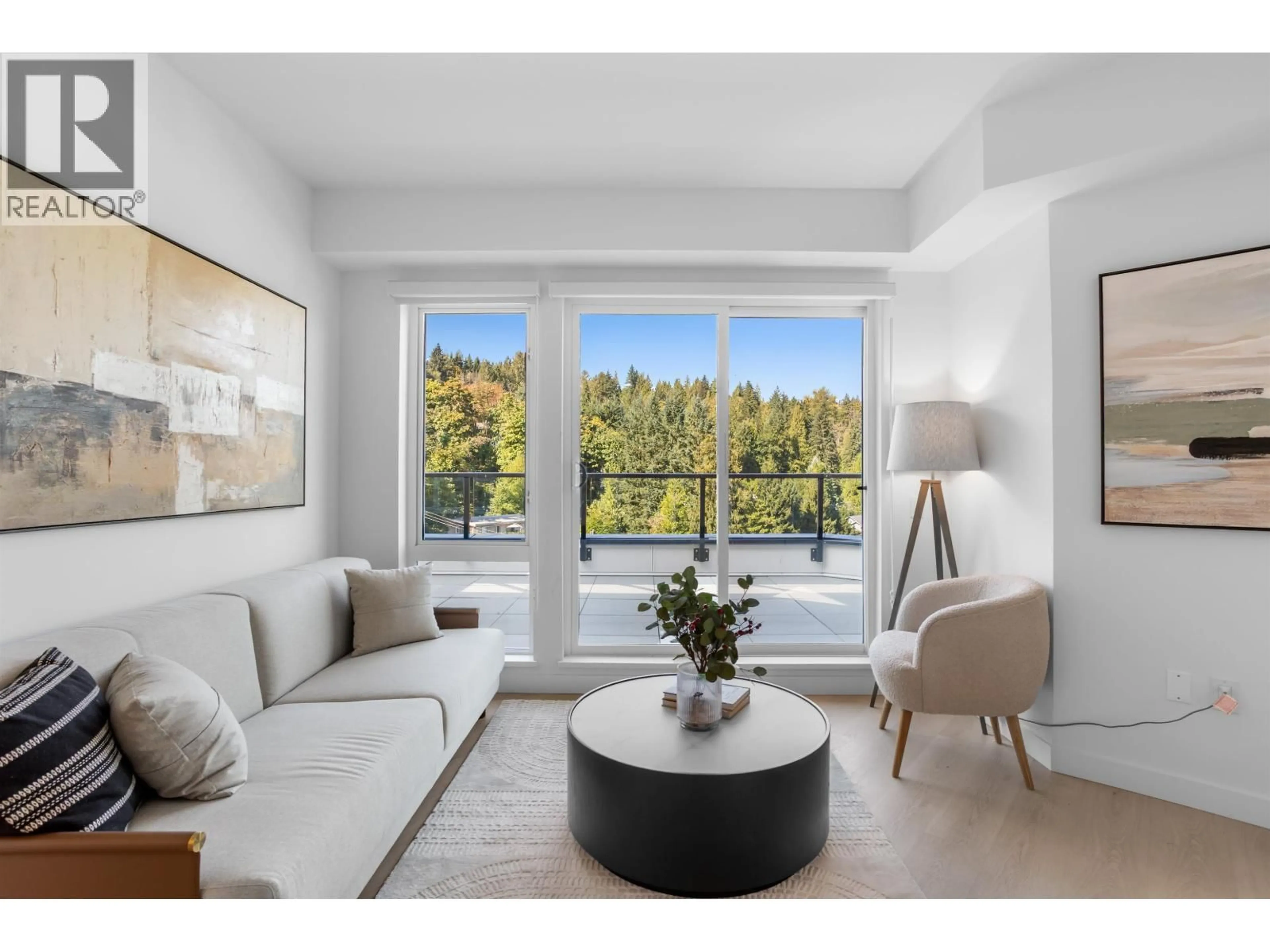 Living room with furniture, unknown for 601 - 1100 CLARKE ROAD, Port Moody British Columbia V3H0N3