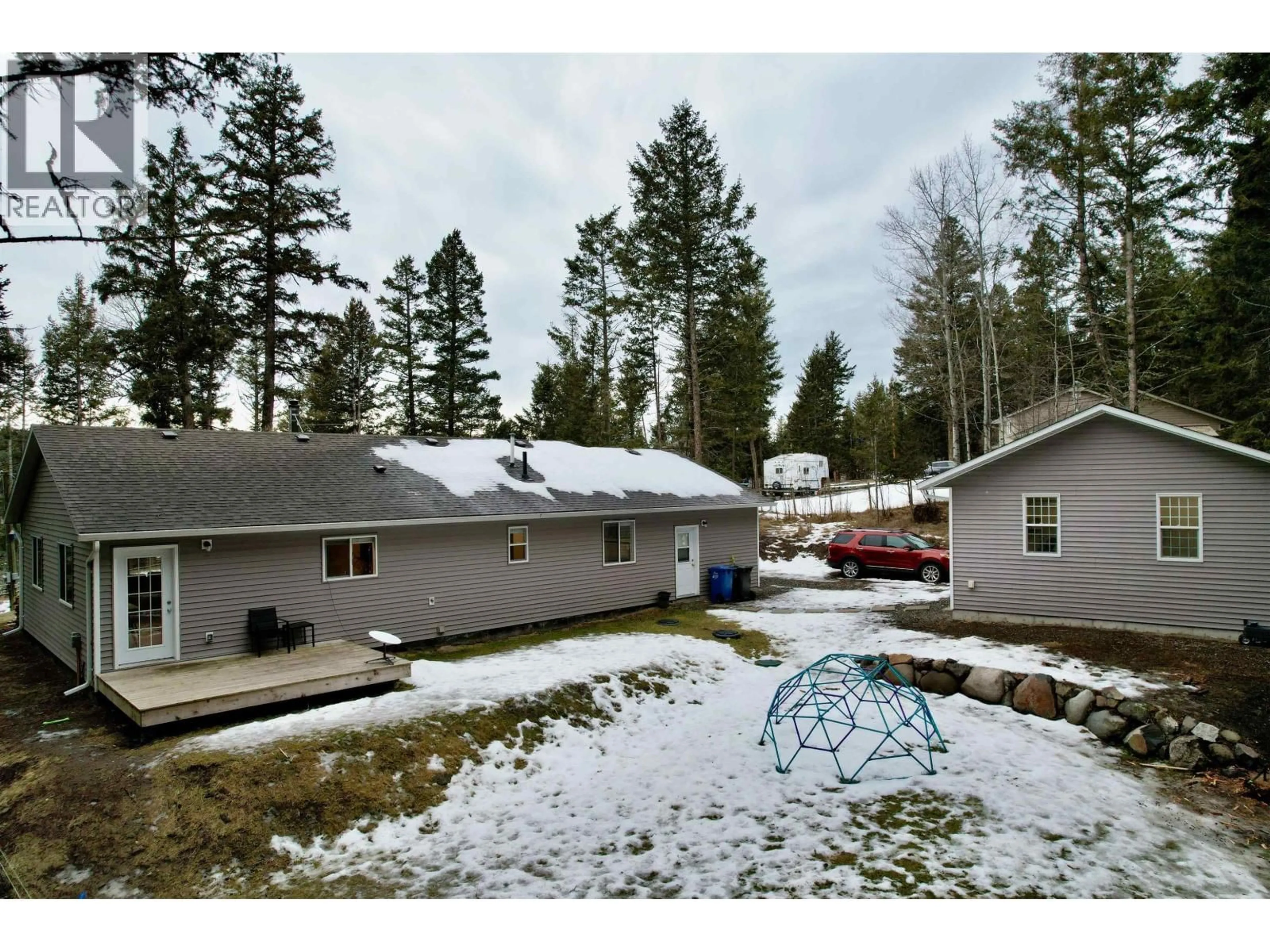 A pic from outside/outdoor area/front of a property/back of a property/a pic from drone, mountain view for 4887 GLOINNZUN CRESCENT, 108 Mile Ranch British Columbia V0K2Z0