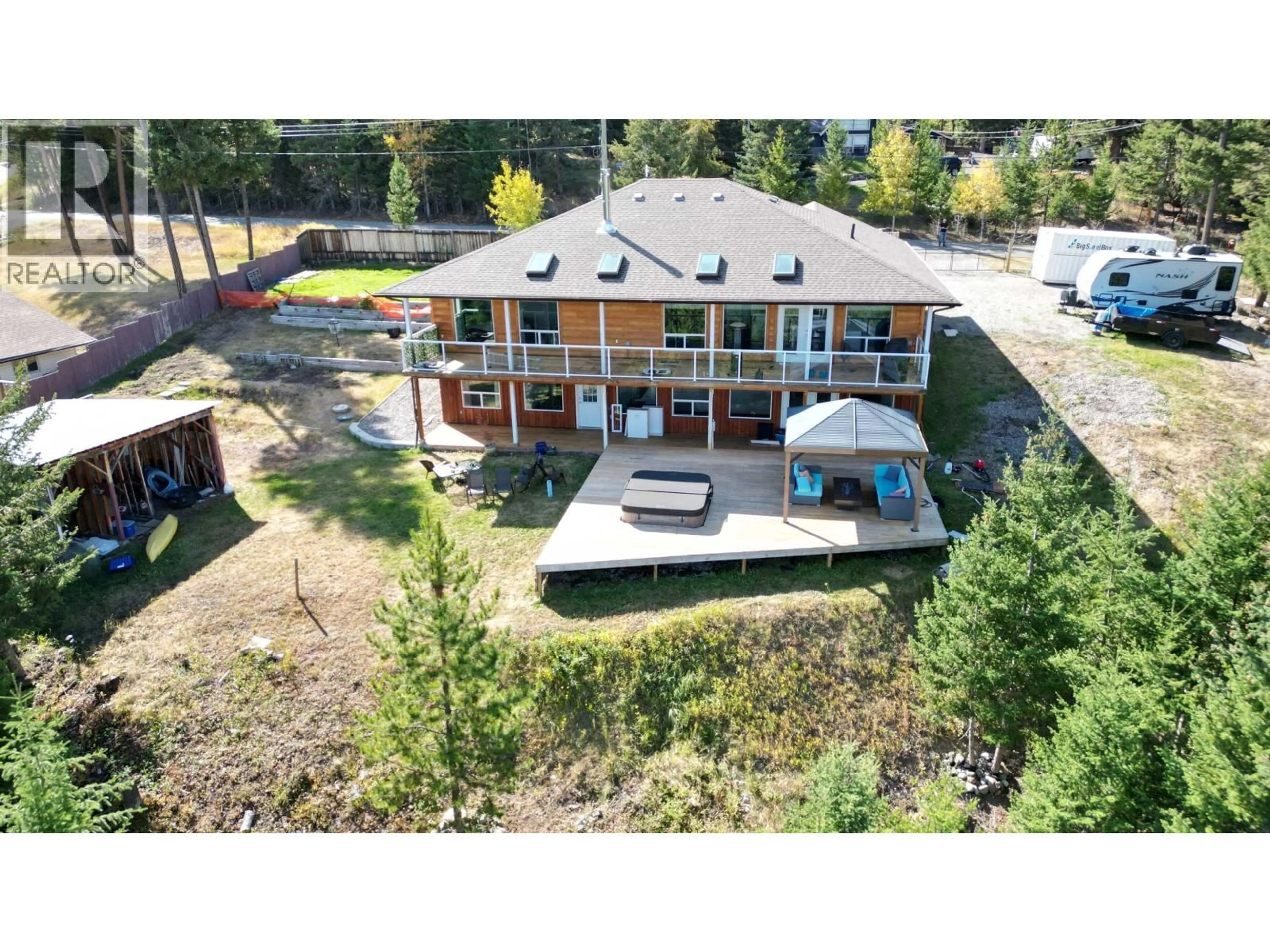 A pic from outside/outdoor area/front of a property/back of a property/a pic from drone, water/lake/river/ocean view for 4849 BRYAN CRESCENT, 108 Mile Ranch British Columbia V0K2Z0