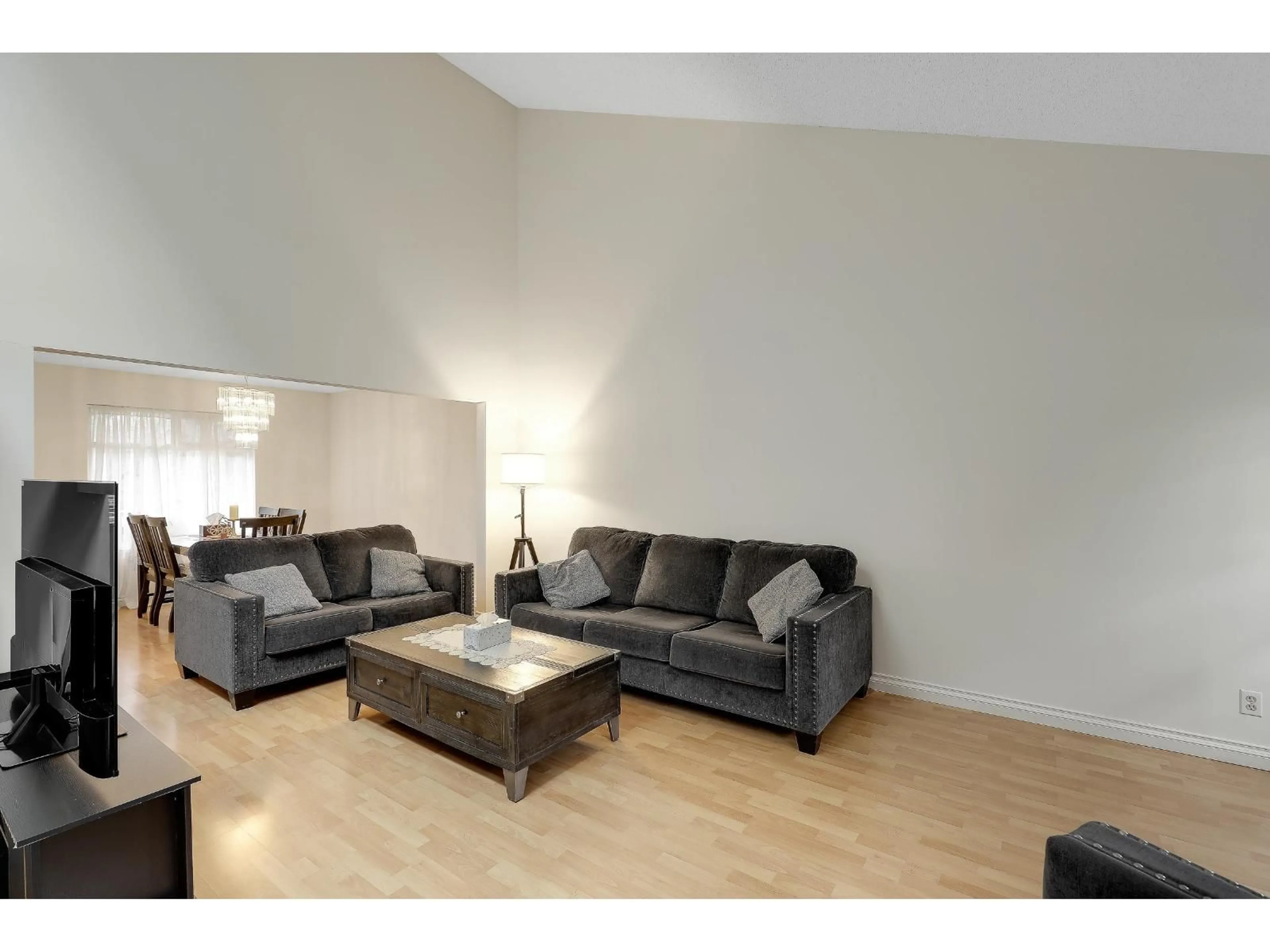 Living room with furniture, wood/laminate floor for 7181 BLAKE DRIVE, Delta British Columbia V4E2W5