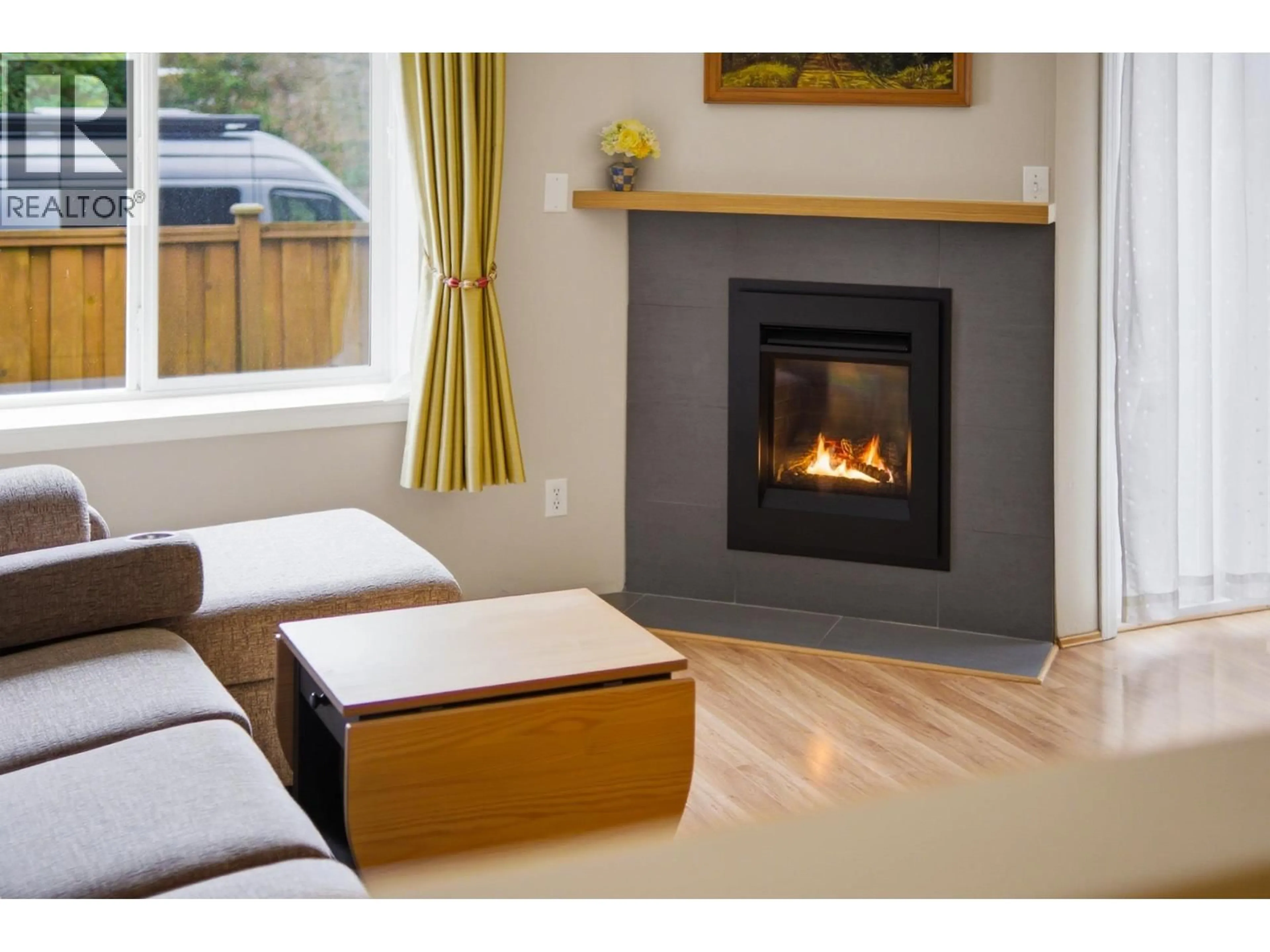 Living room with furniture, wood/laminate floor for 11 - 40200 GOVERNMENT ROAD, Squamish British Columbia V8B0G6