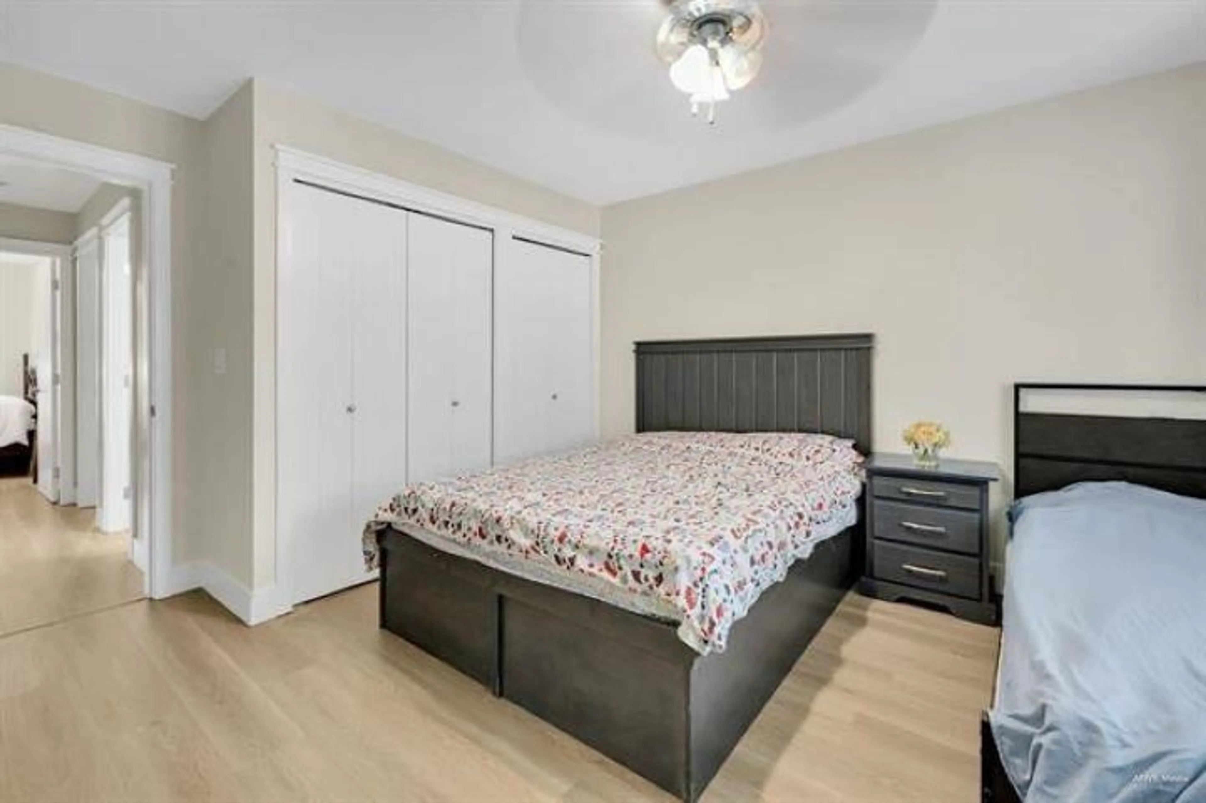 Bedroom with bed, wood/laminate floor for 110 - 13368 72 AVENUE, Surrey British Columbia V3W2N6