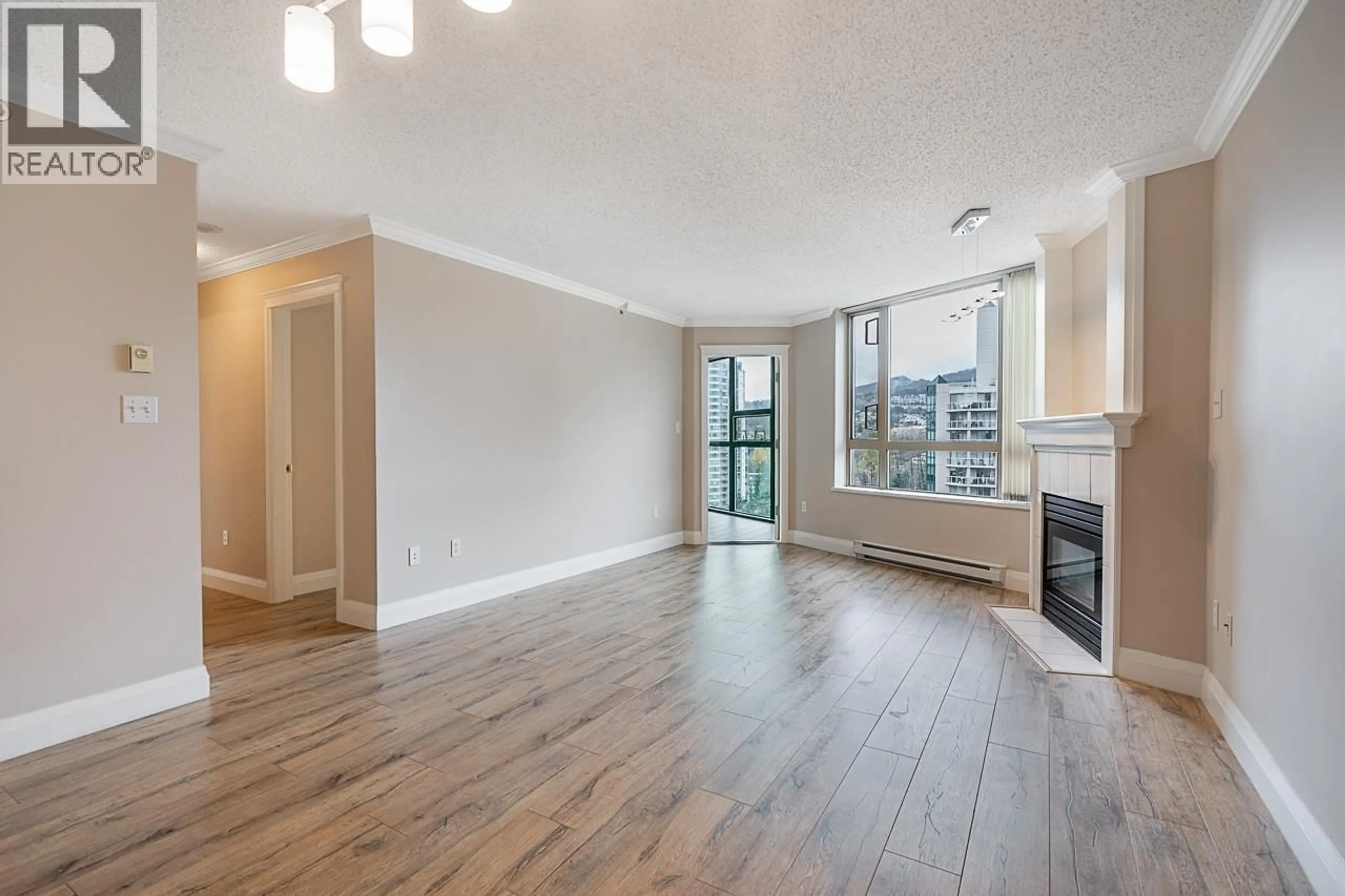 Living room with furniture, wood/laminate floor for 1305 - 1190 PIPELINE ROAD, Coquitlam British Columbia V3B7T9