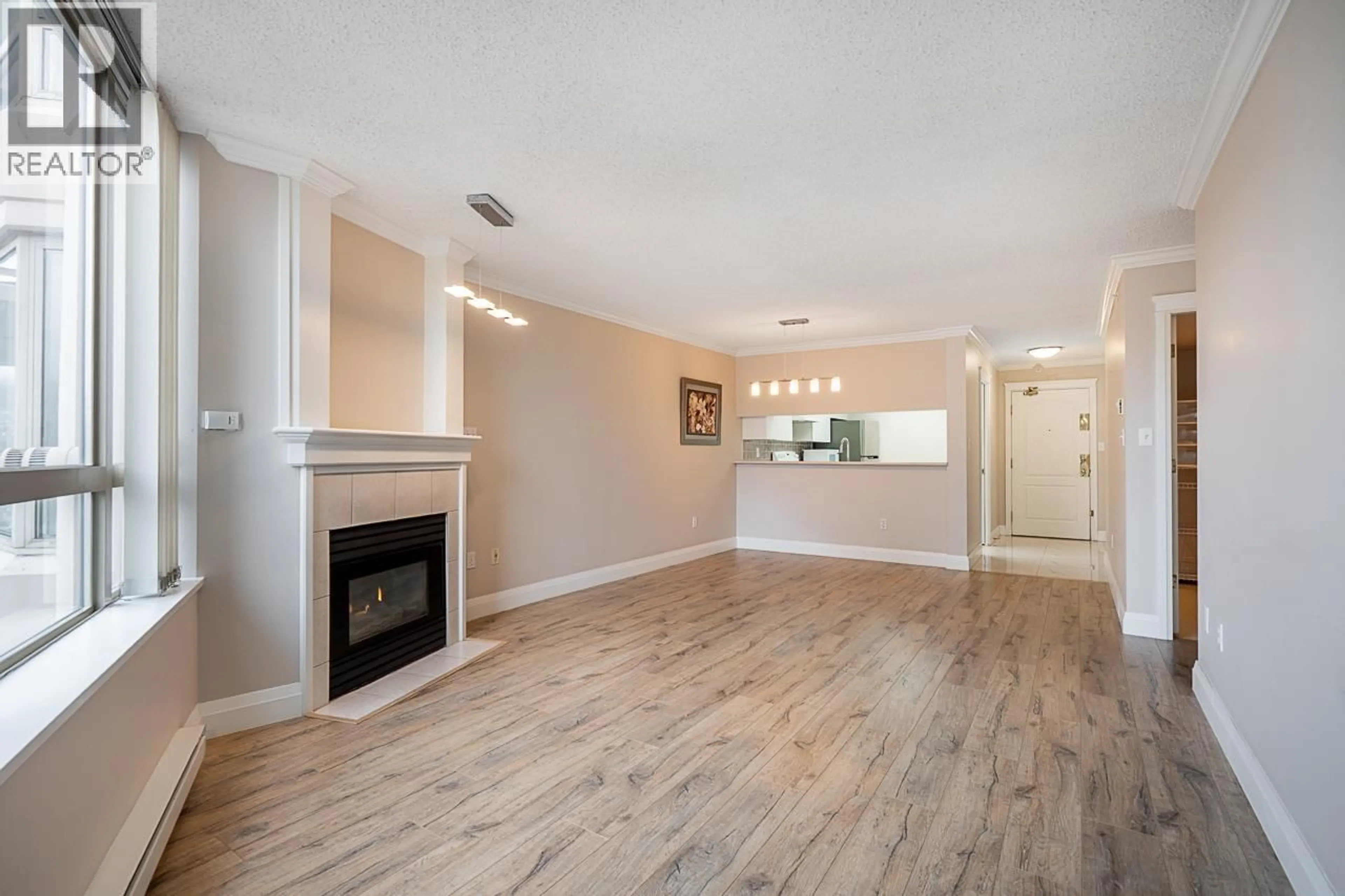 Living room with furniture, wood/laminate floor for 1305 - 1190 PIPELINE ROAD, Coquitlam British Columbia V3B7T9