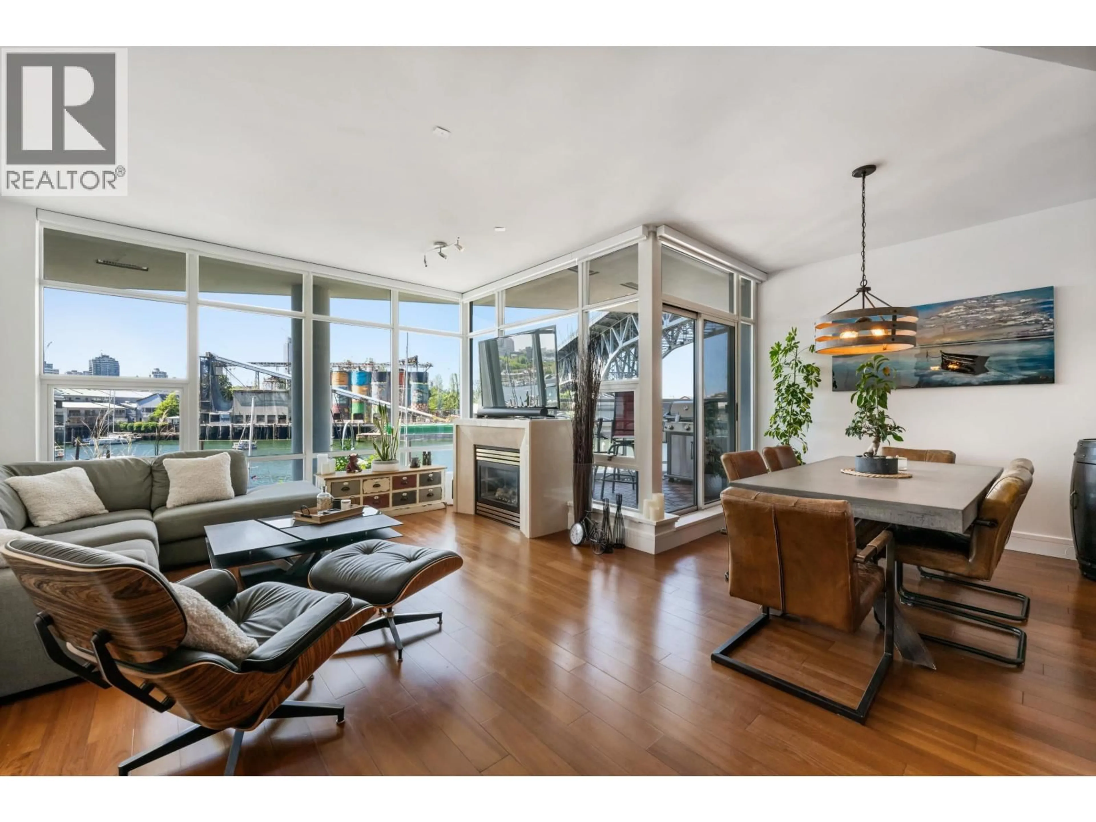 Open concept kitchen, wood/laminate floor for 203 - 628 KINGHORNE MEWS, Vancouver British Columbia V6Z3H6