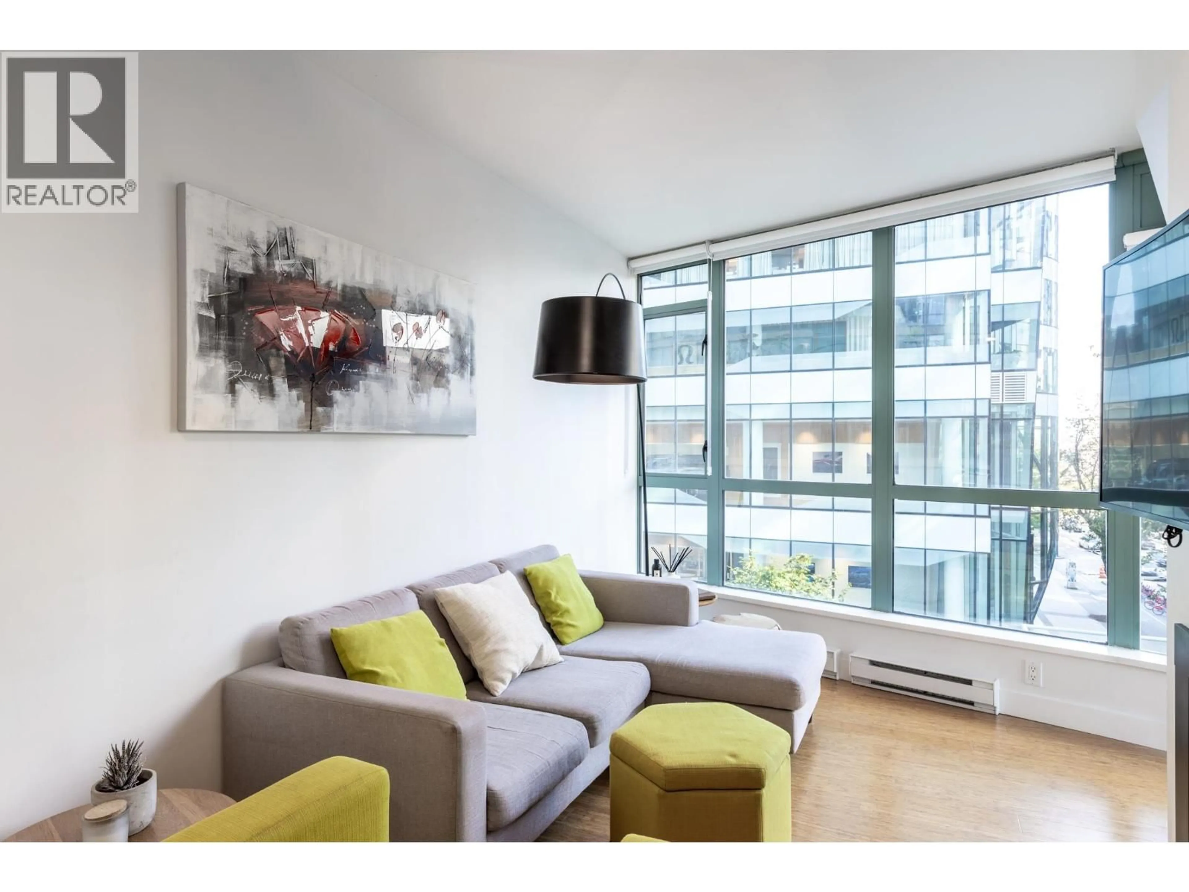 Living room with furniture, wood/laminate floor for 404 - 1238 BURRARD STREET, Vancouver British Columbia V6Z3E1