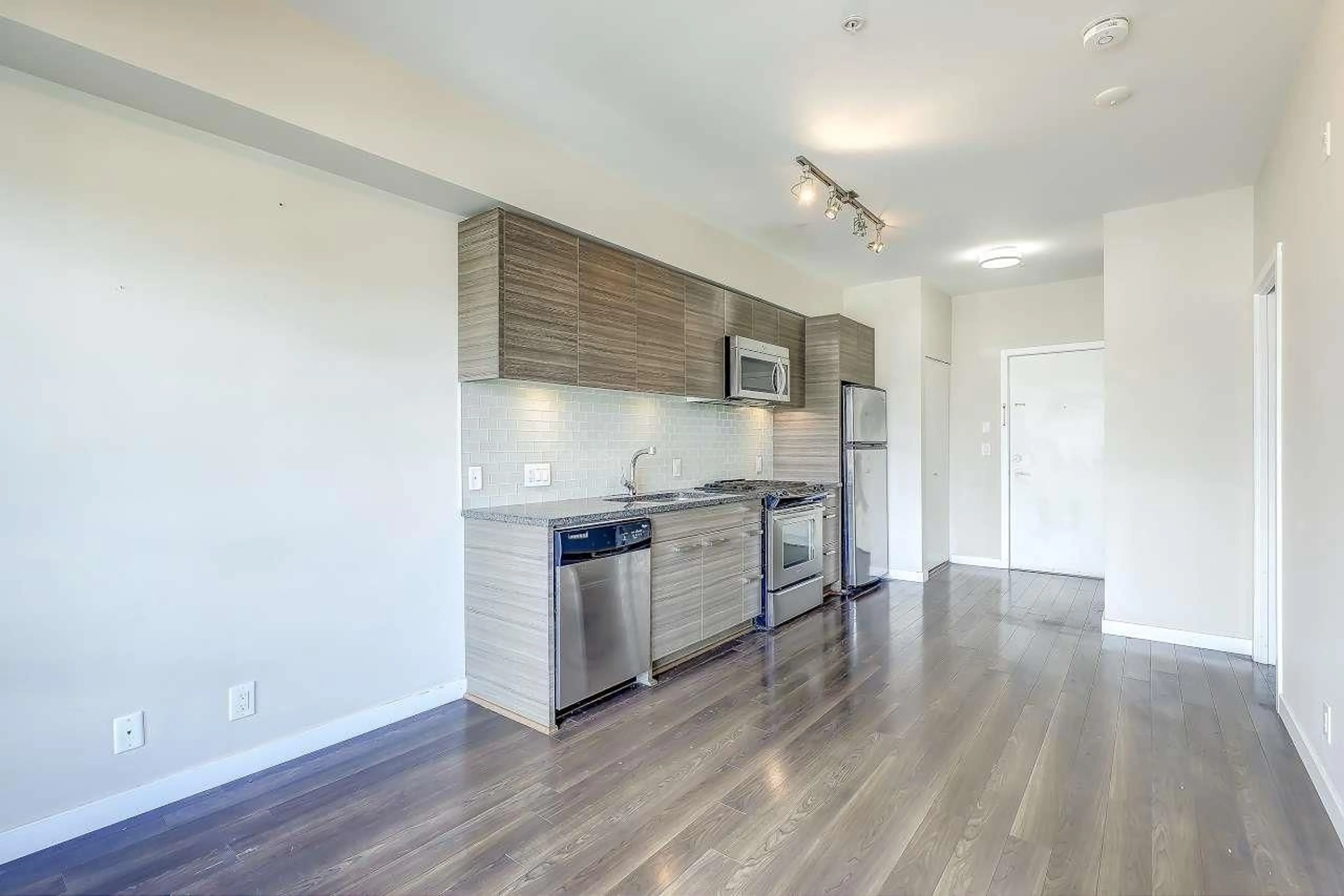 Open concept kitchen, wood/laminate floor for 301 - 13228 OLD YALE ROAD, Surrey British Columbia V3T0K3