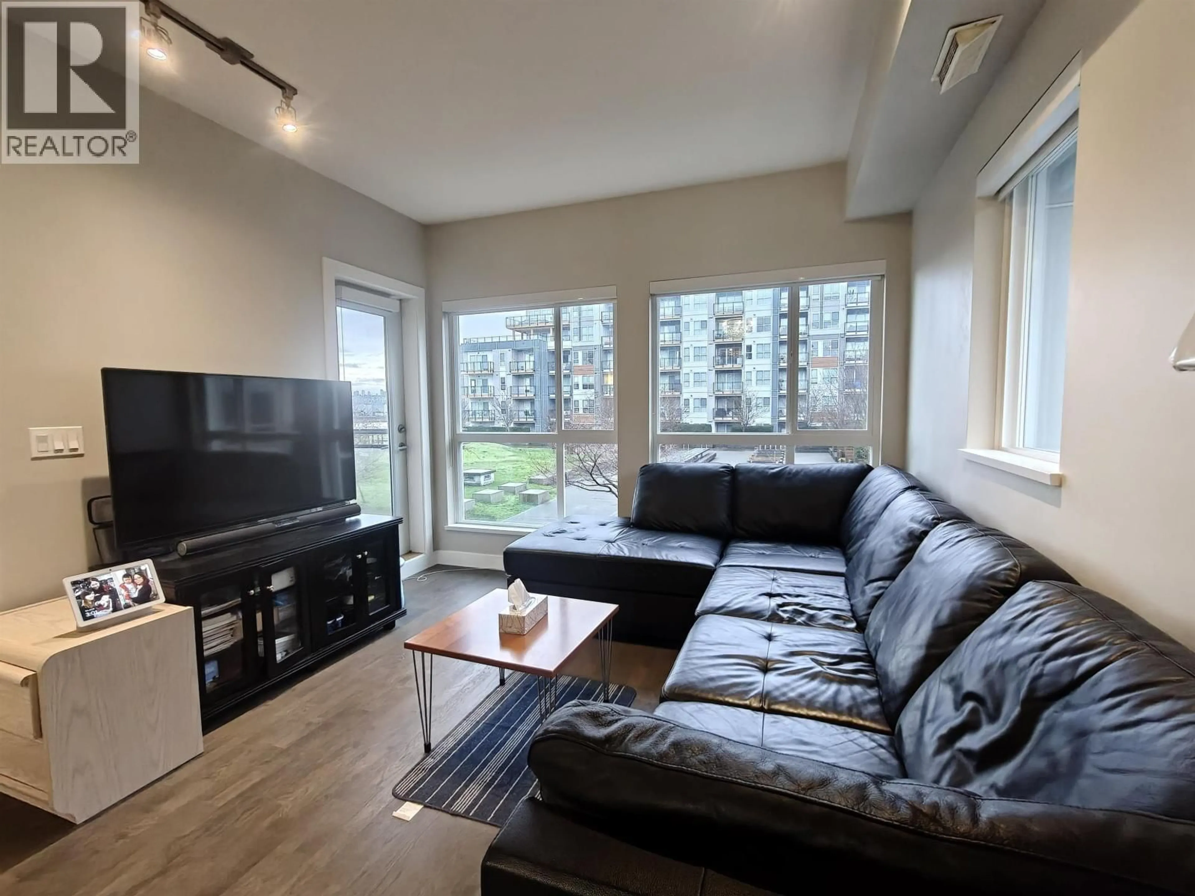 Living room with furniture, wood/laminate floor for 212 - 10155 RIVER DRIVE, Richmond British Columbia V6X0L3