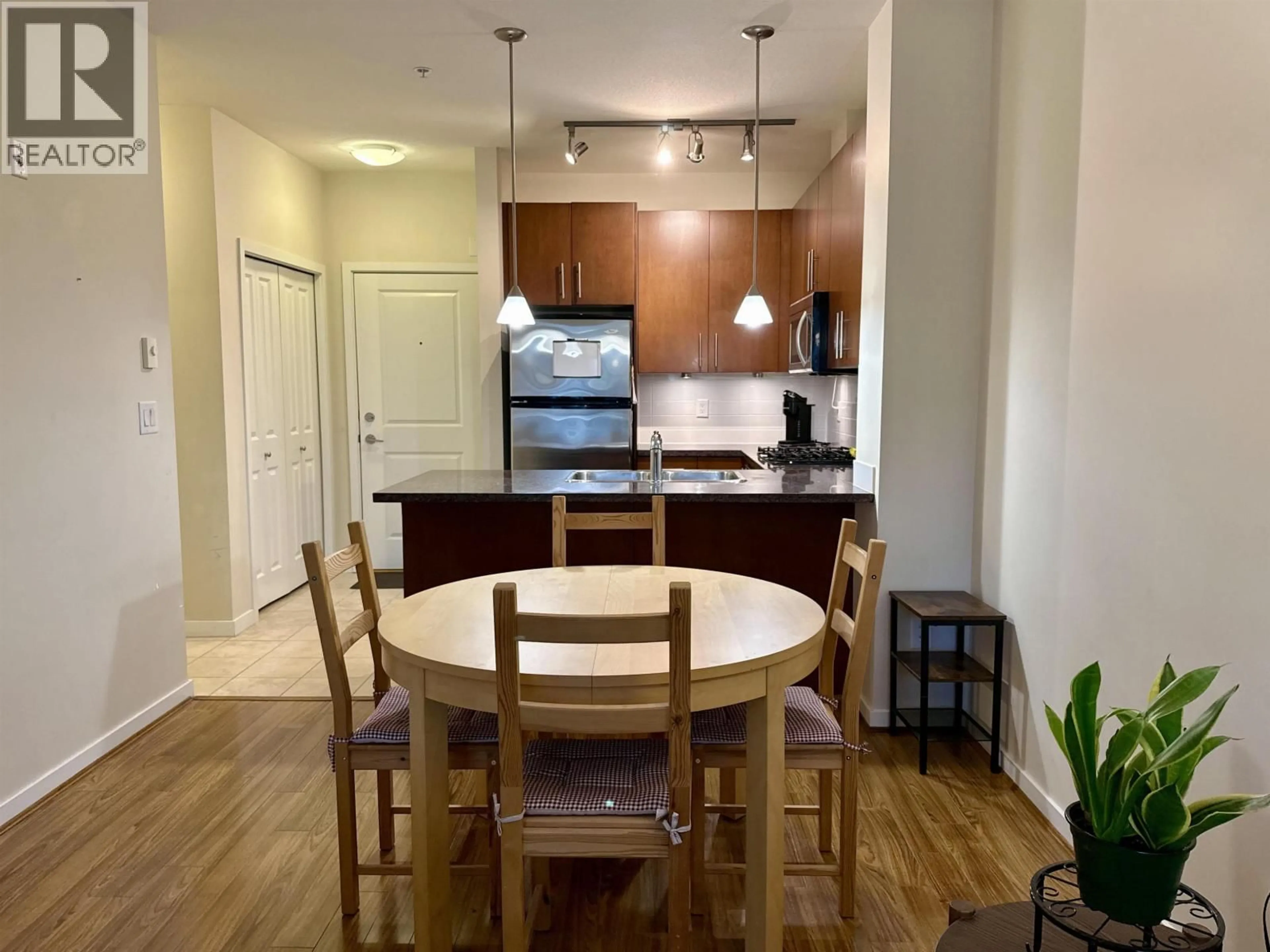 Open concept kitchen, wood/laminate floor for 301 - 3651 FOSTER AVENUE, Vancouver British Columbia V5R0A2