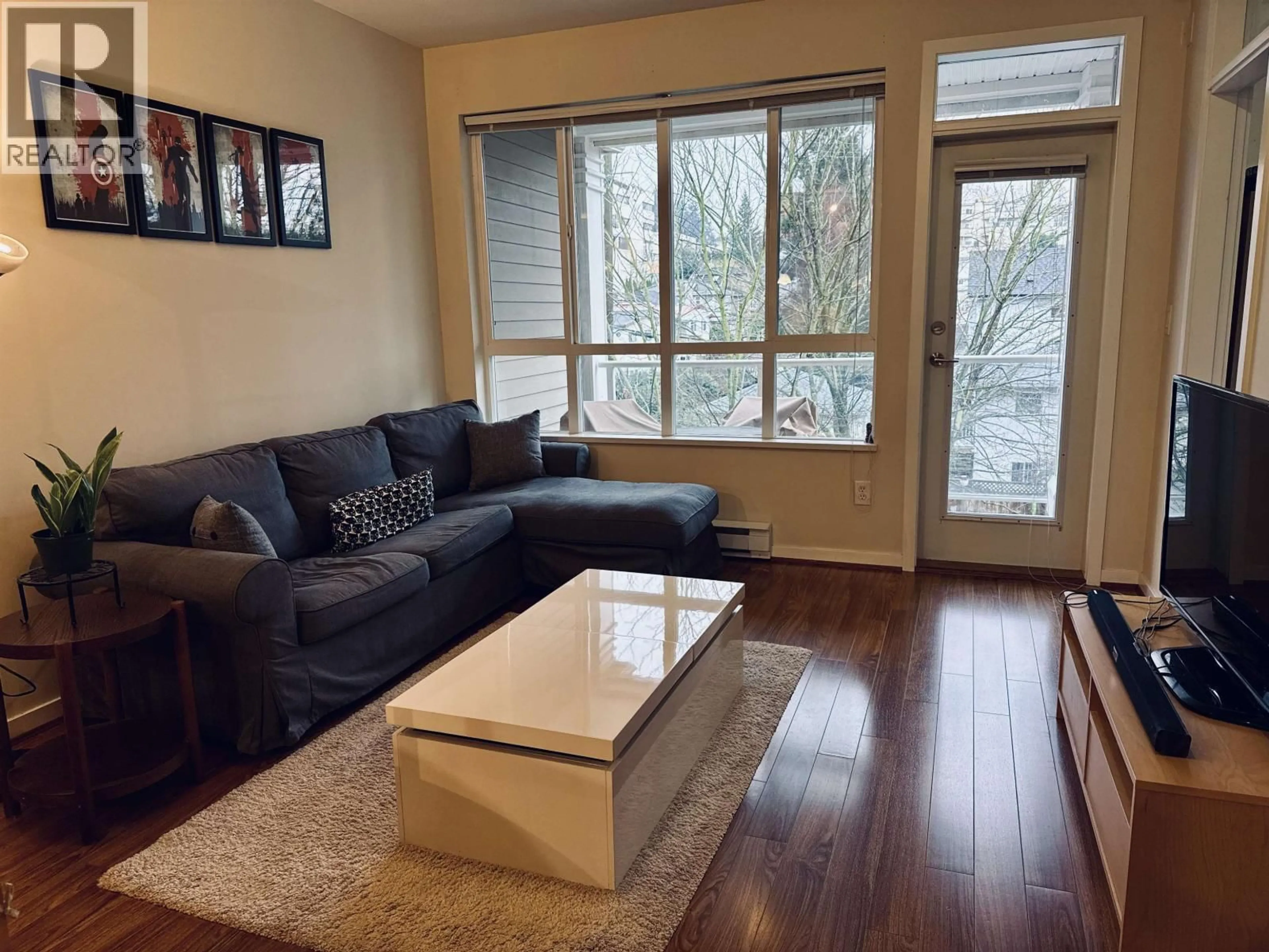 Living room with furniture, wood/laminate floor for 301 - 3651 FOSTER AVENUE, Vancouver British Columbia V5R0A2