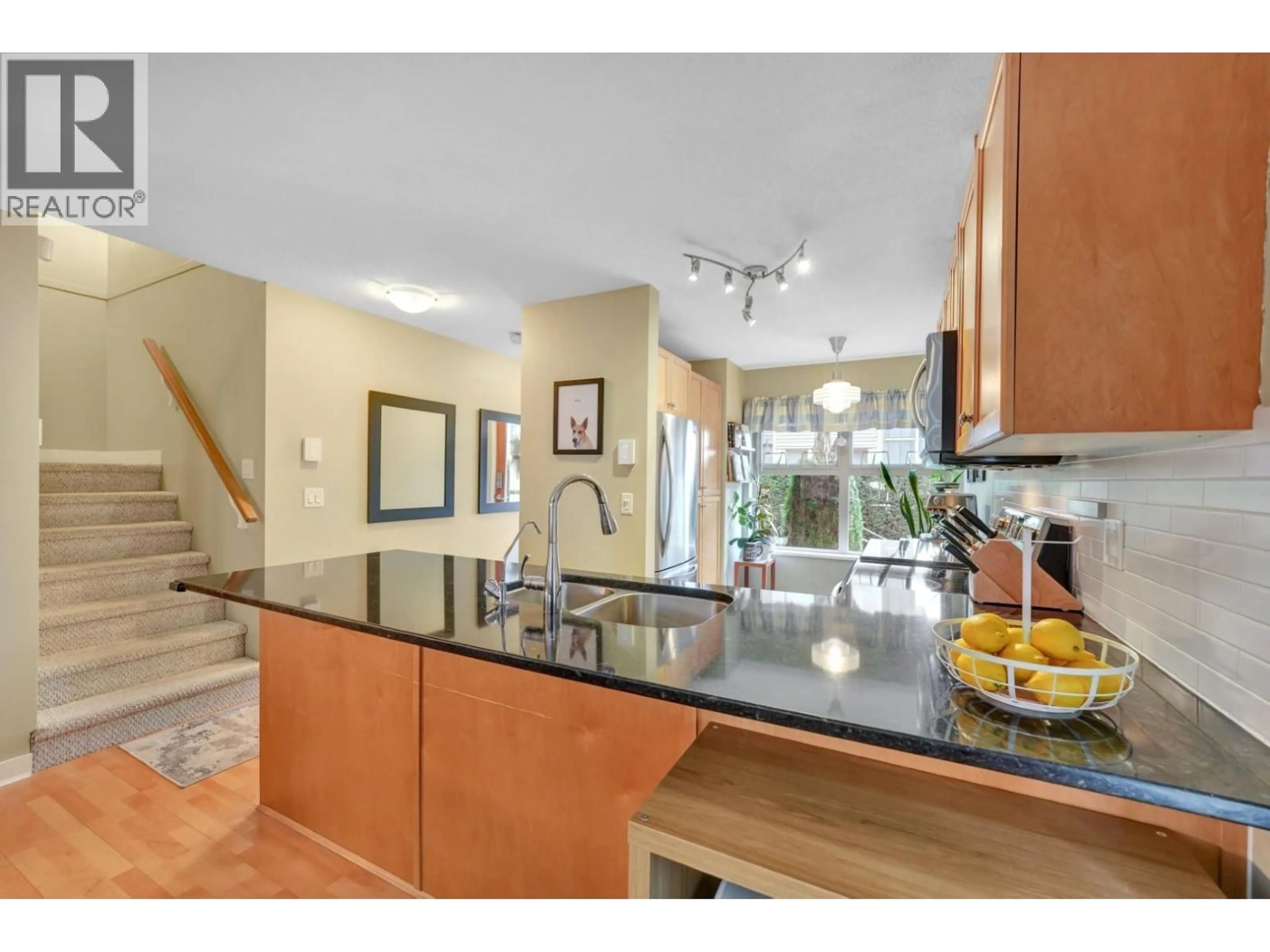 Open concept kitchen, ceramic/tile floor for 36 - 3855 PENDER STREET, Burnaby British Columbia V5C1W5