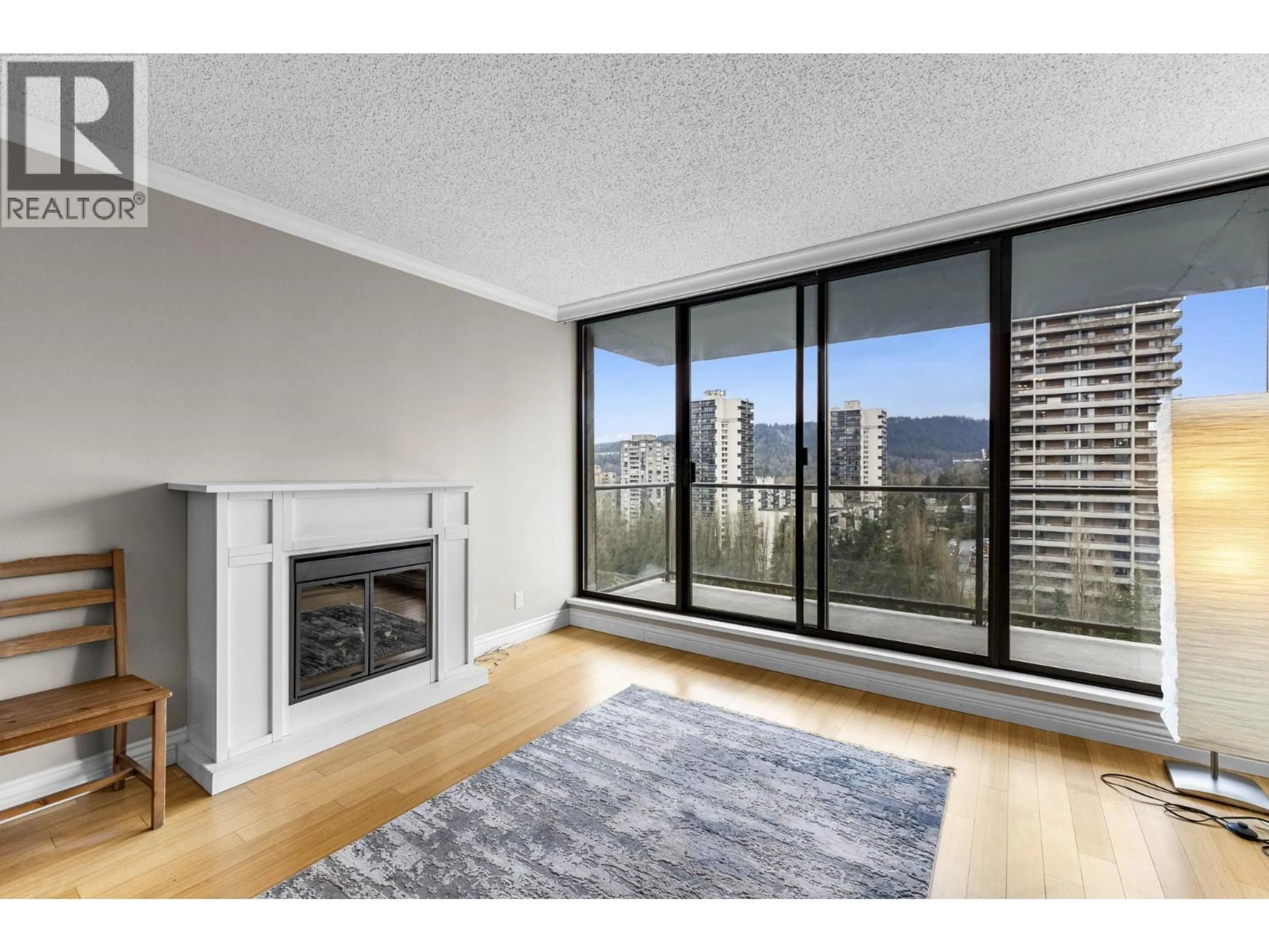 Living room with furniture, wood/laminate floor for 1607 - 3970 CARRIGAN COURT, Burnaby British Columbia V3N4S5