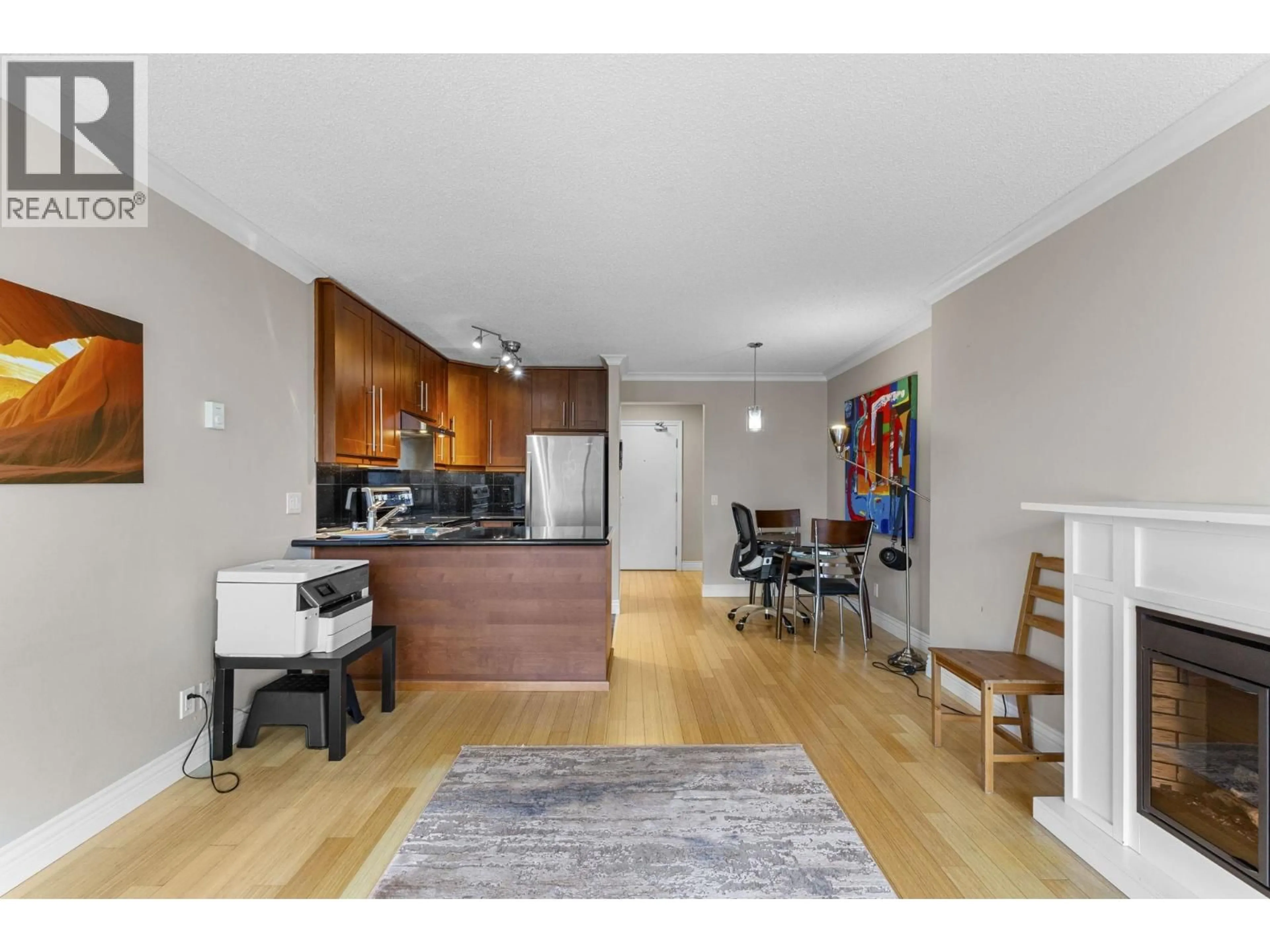 Open concept kitchen, wood/laminate floor for 1607 - 3970 CARRIGAN COURT, Burnaby British Columbia V3N4S5