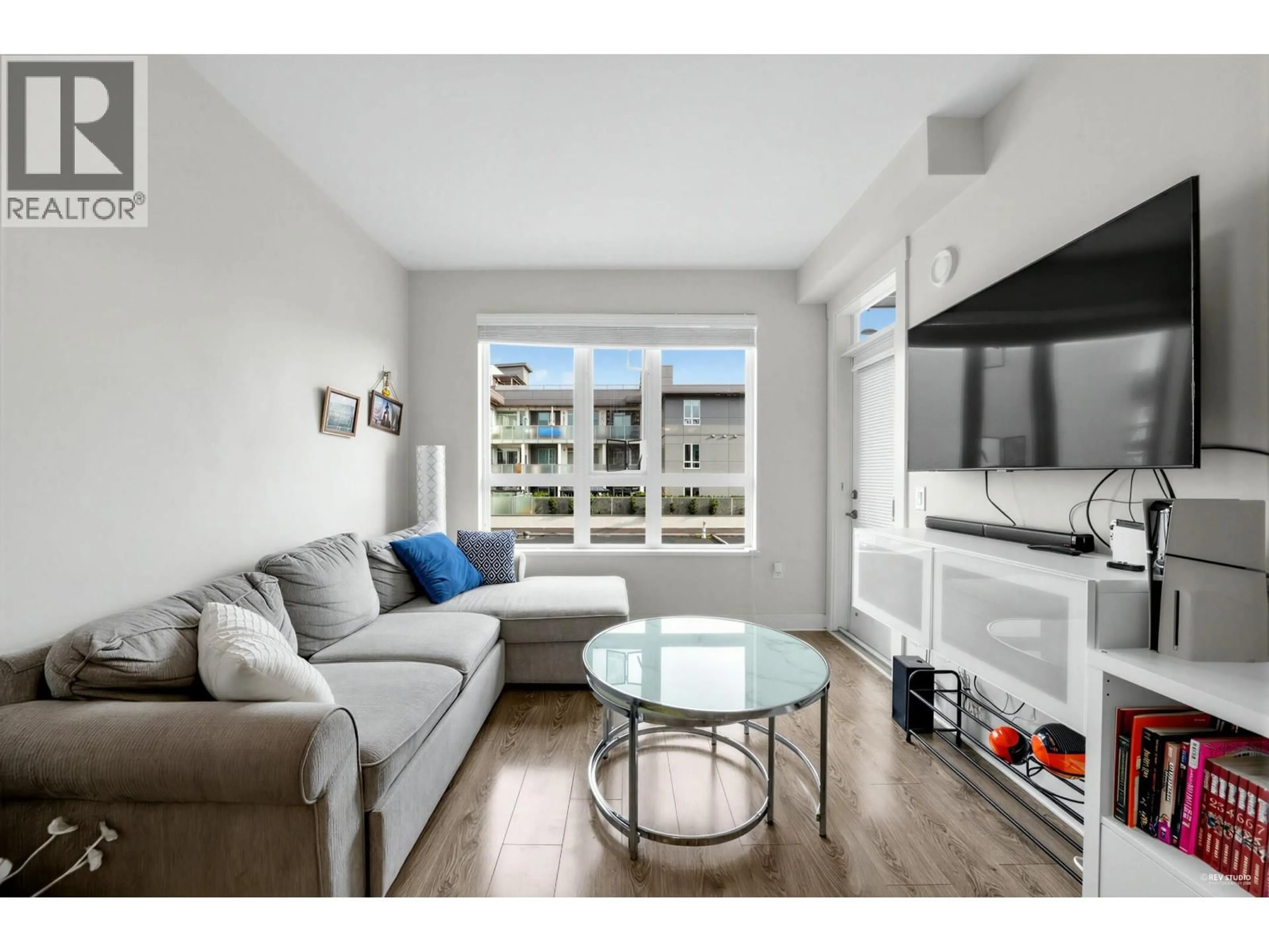 Living room with furniture, wood/laminate floor for 307 - 733 14 STREET, North Vancouver British Columbia V7M0C6