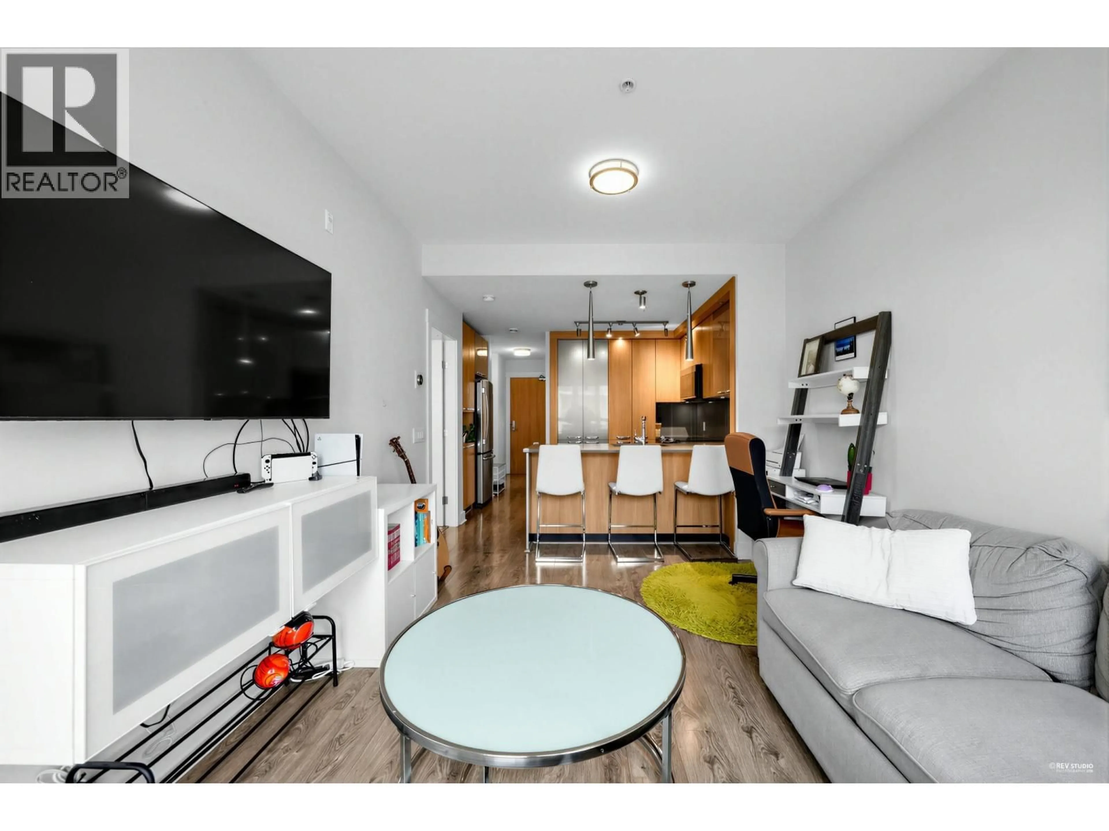 Living room with furniture, wood/laminate floor for 307 - 733 14 STREET, North Vancouver British Columbia V7M0C6