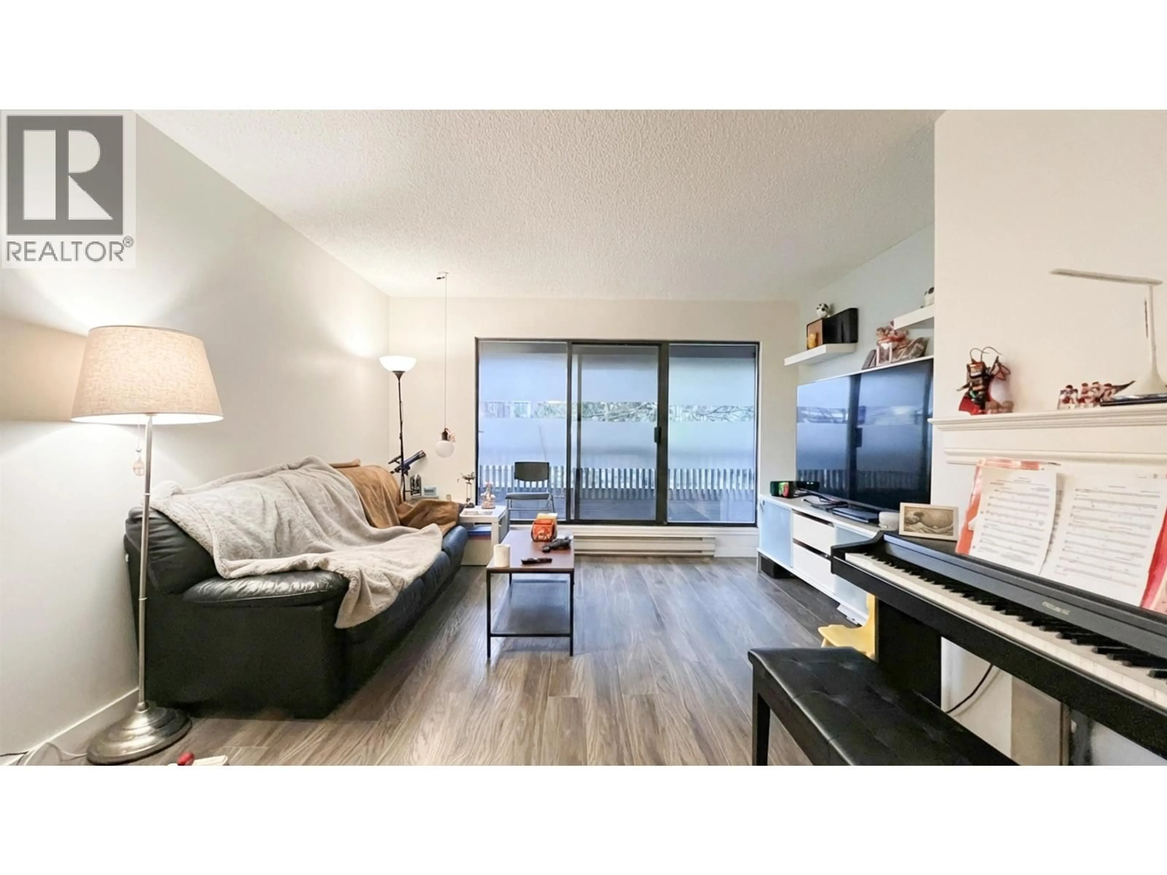 Living room with furniture, wood/laminate floor for 302 - 5800 COONEY ROAD, Richmond British Columbia V6X3A8