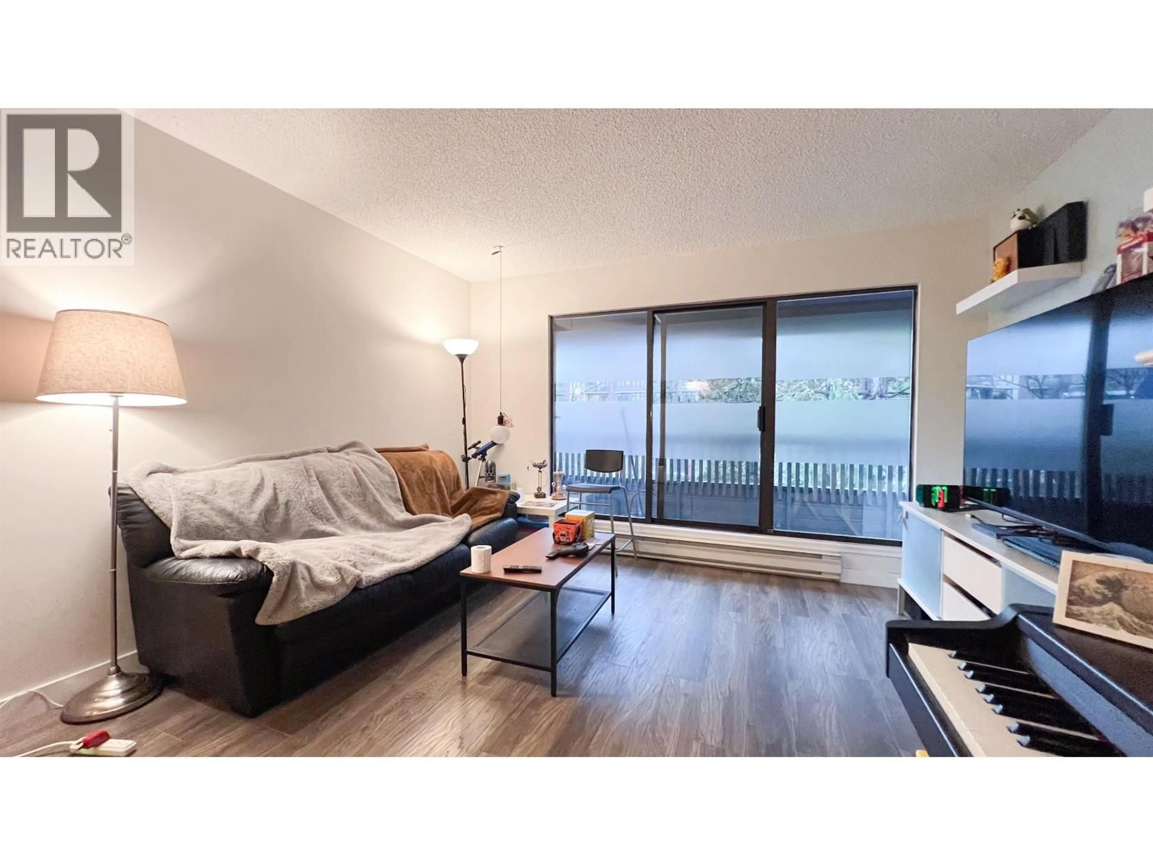 Living room with furniture, wood/laminate floor for 302 - 5800 COONEY ROAD, Richmond British Columbia V6X3A8