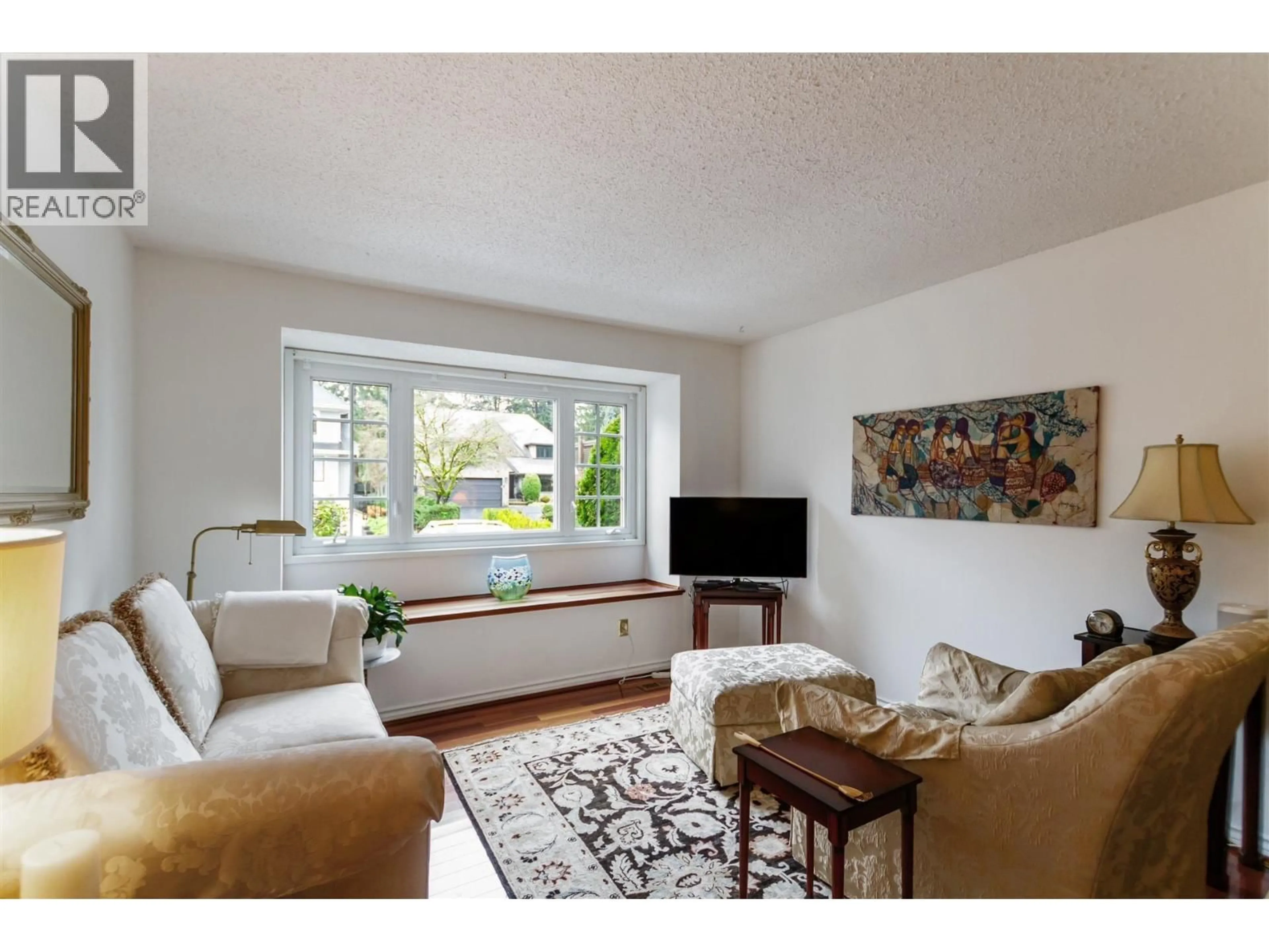 Living room with furniture, wood/laminate floor for 4171 DONCASTER WAY, Vancouver British Columbia V6S1W1