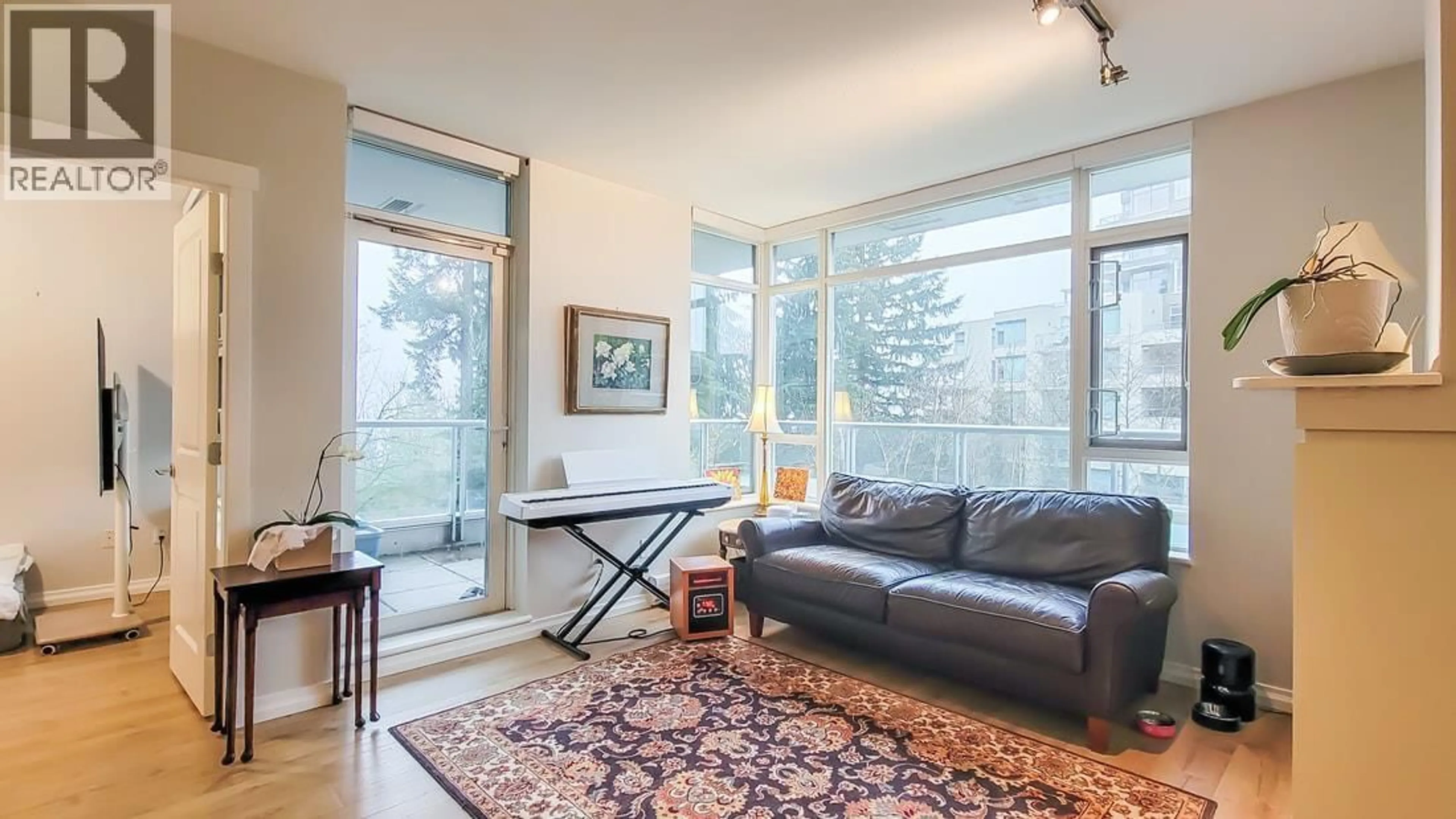 Living room with furniture, unknown for 301 - 9266 UNIVERSITY CRESCENT, Burnaby British Columbia V5A4Z1