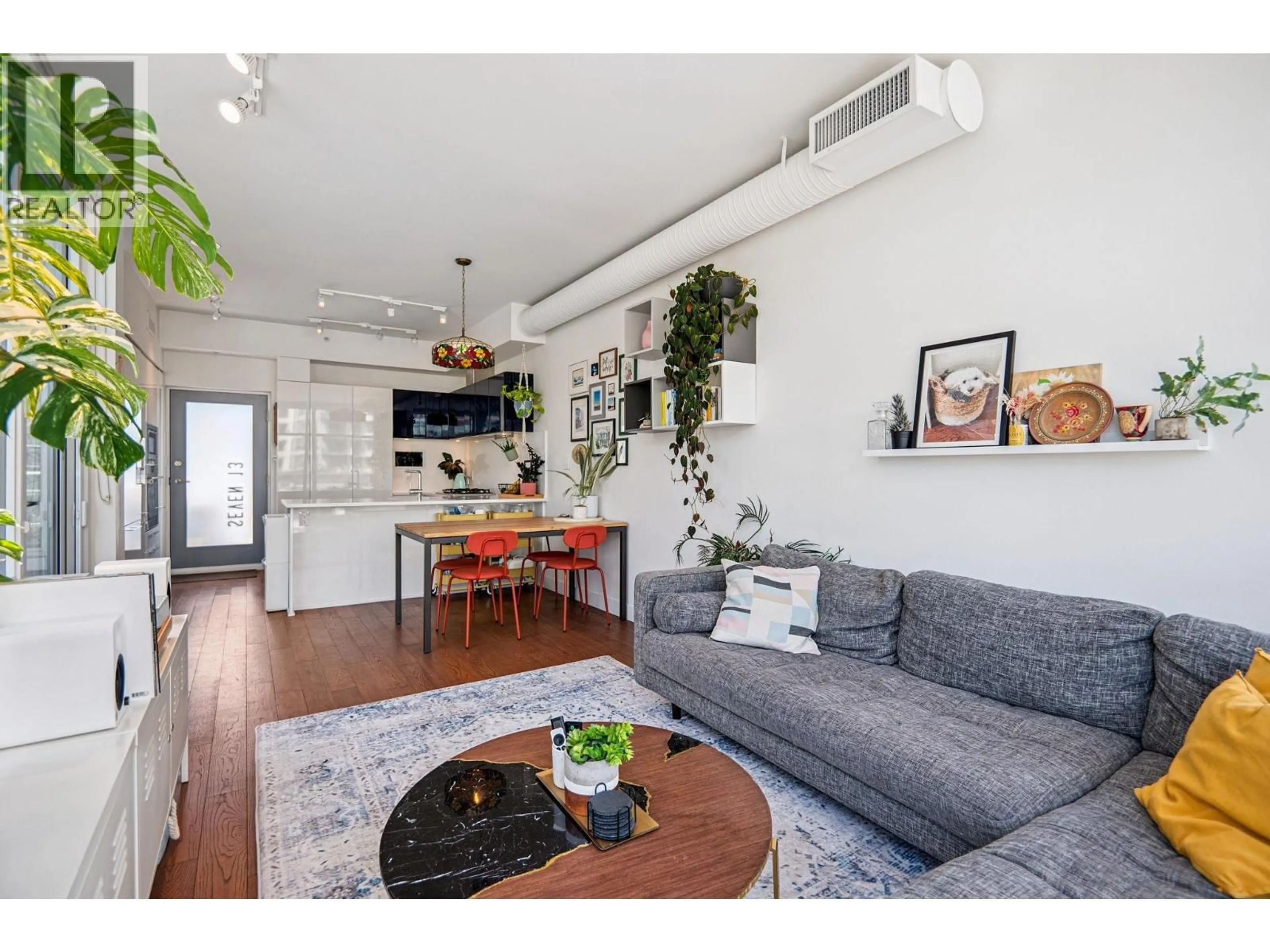 Living room with furniture, wood/laminate floor for 713 - 108 1ST AVENUE, Vancouver British Columbia V5T0E4