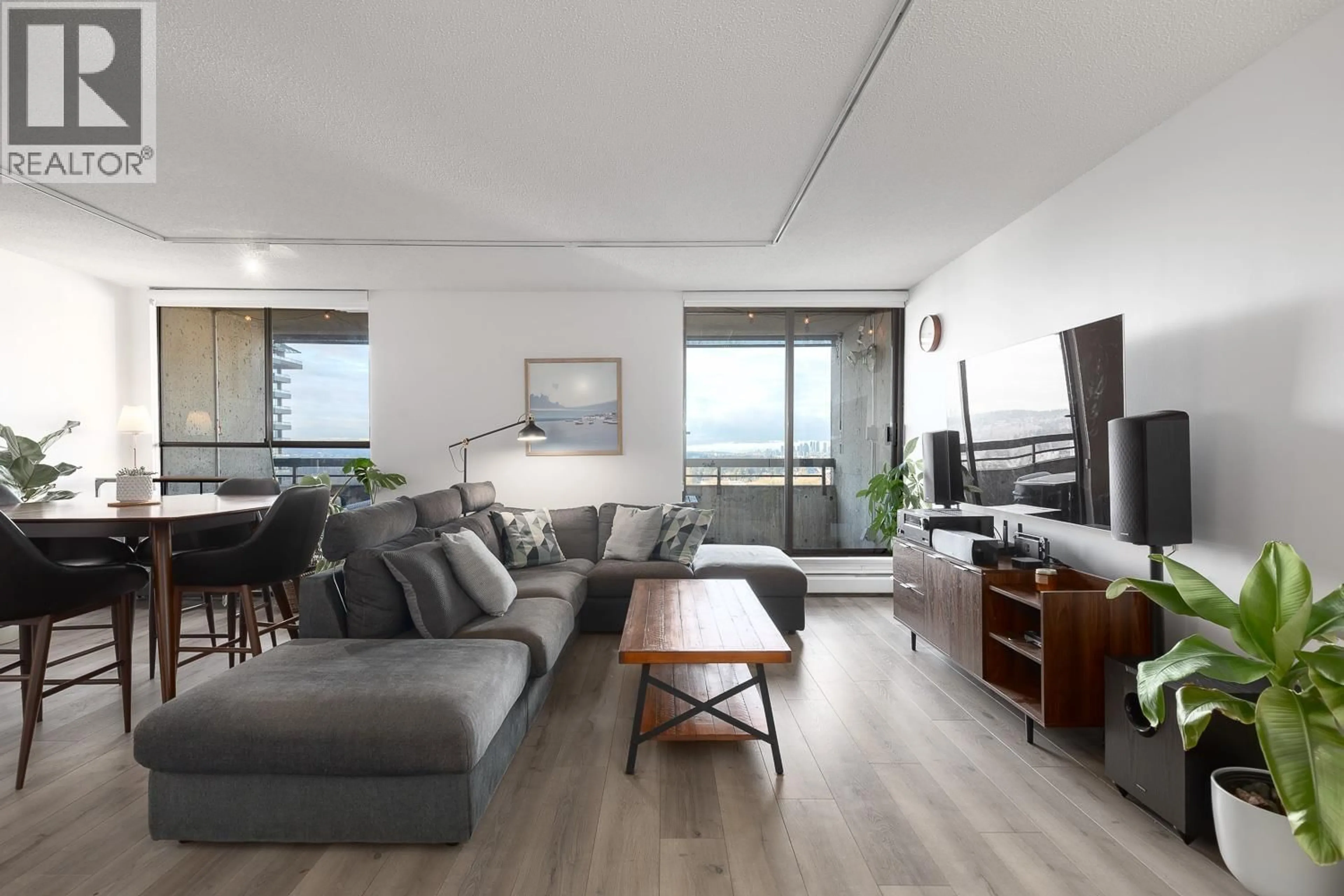 Living room with furniture, wood/laminate floor for 2101 - 3771 BARTLETT COURT, Burnaby British Columbia V3J7G8