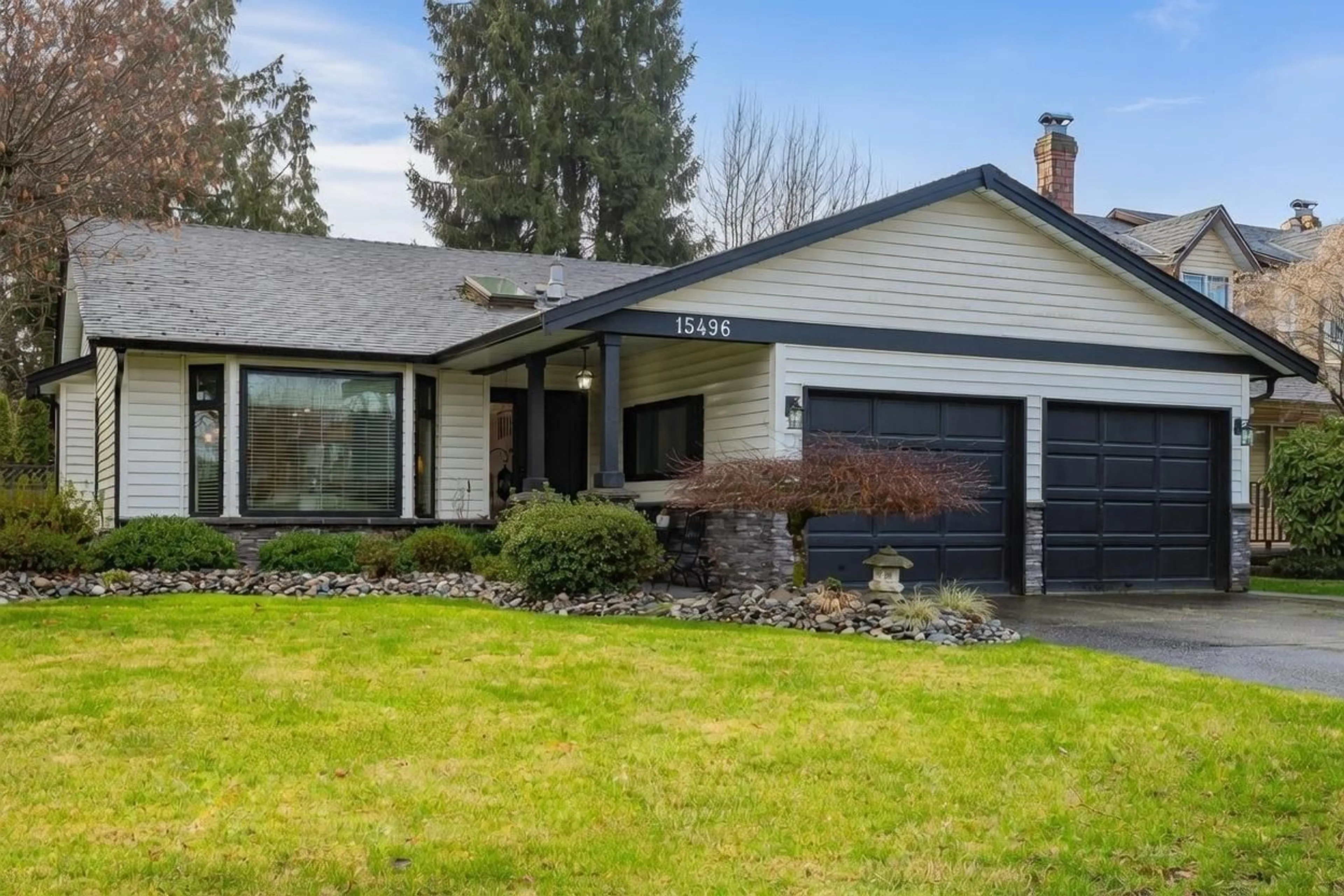 Home with vinyl exterior material, street for 15496 93RD AVENUE, Surrey British Columbia V3R9B6