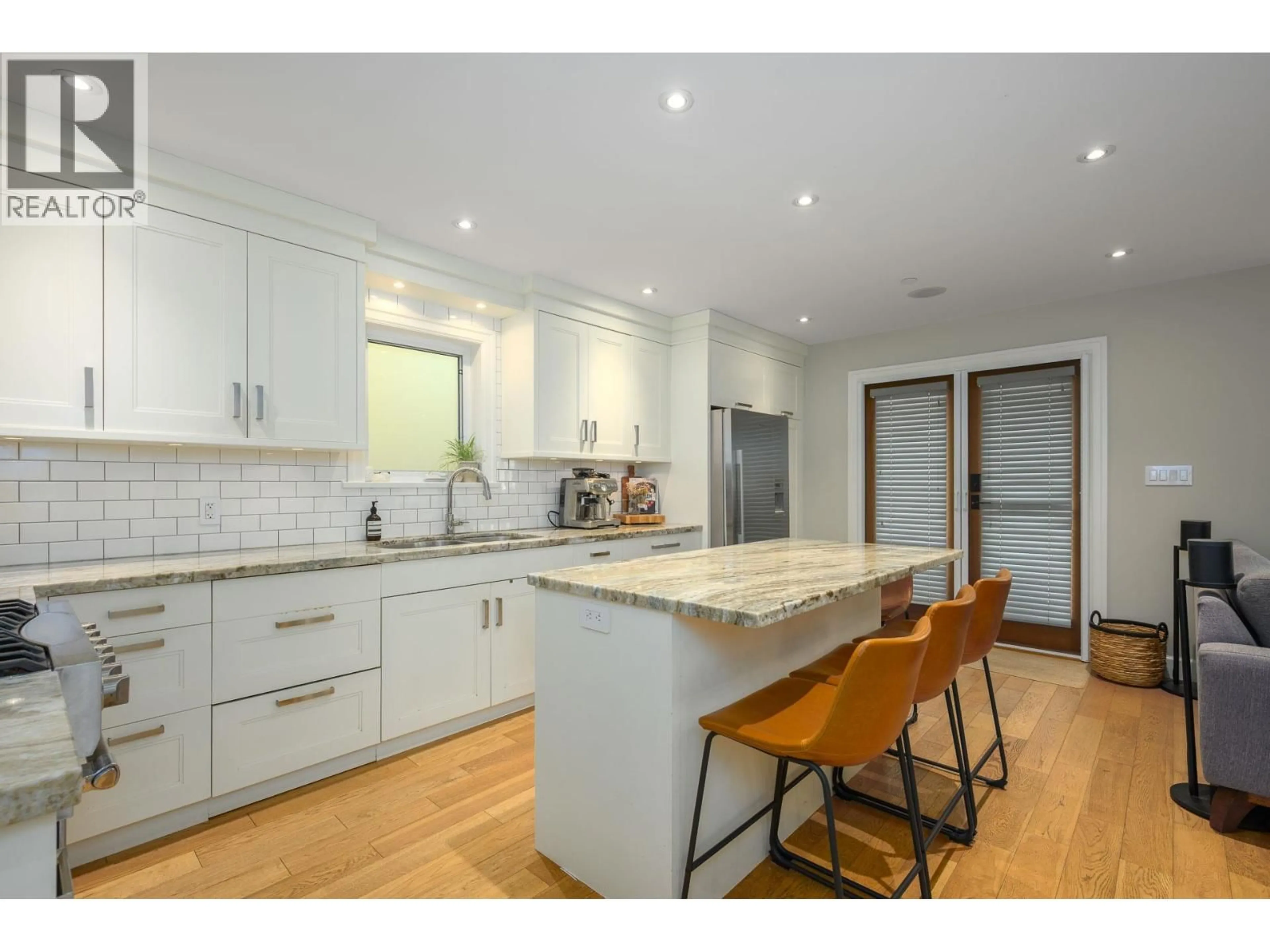 Open concept kitchen, wood/laminate floor for 4241 BALKAN STREET, Vancouver British Columbia V5V3Z4