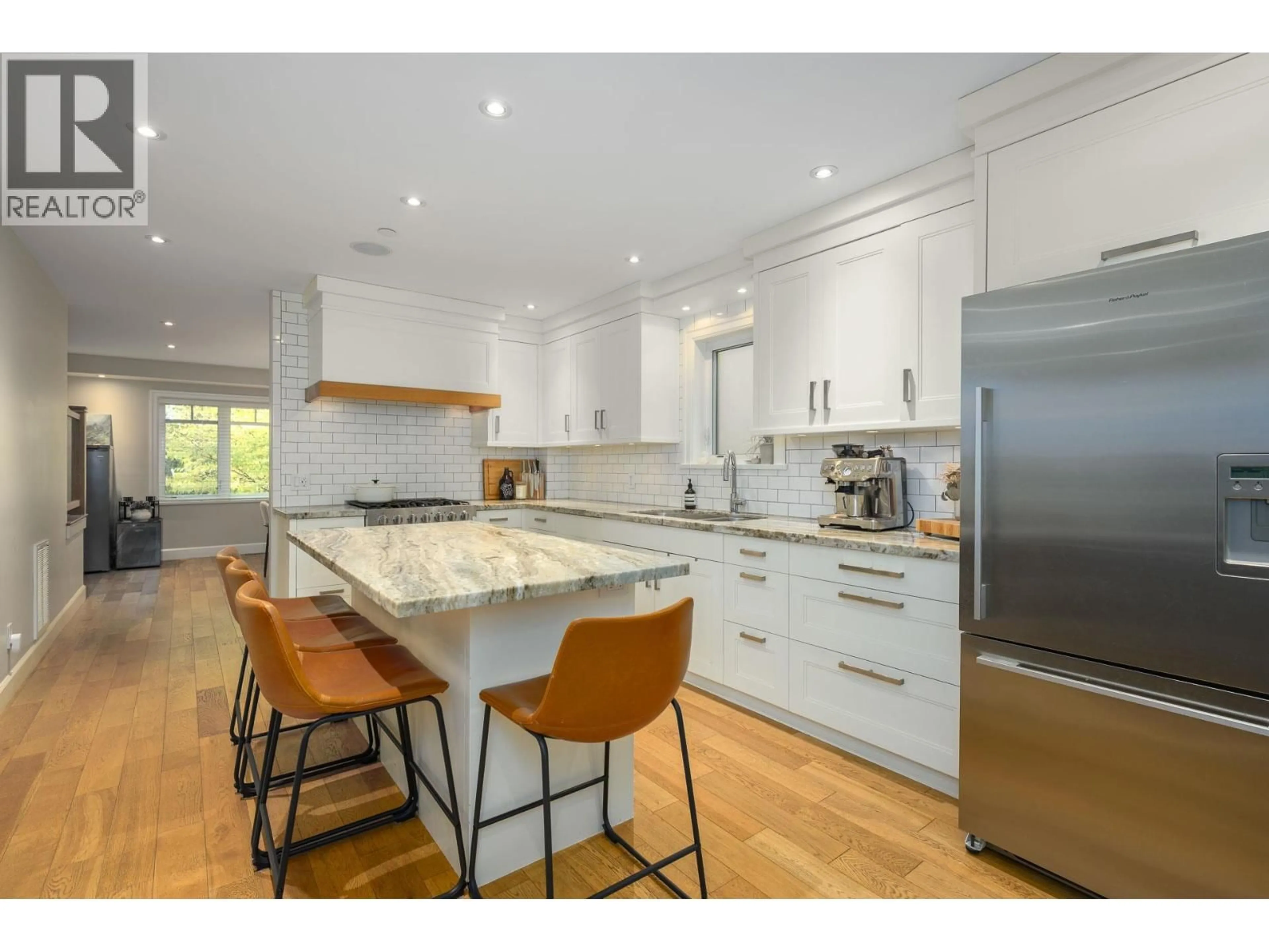Open concept kitchen, wood/laminate floor for 4241 BALKAN STREET, Vancouver British Columbia V5V3Z4