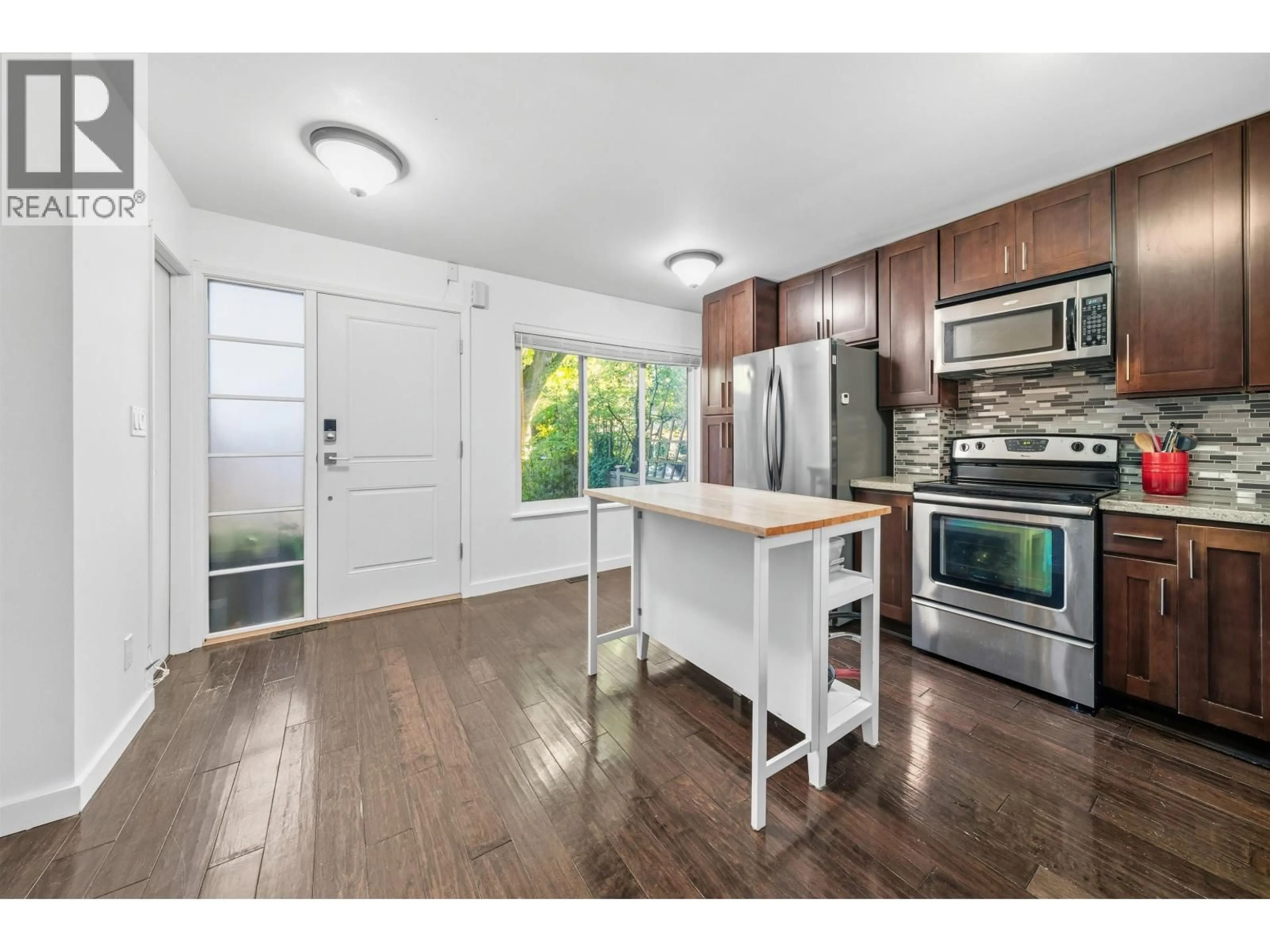 Open concept kitchen, wood/laminate floor for 4742 LAURELWOOD PLACE, Burnaby British Columbia V5G4B2