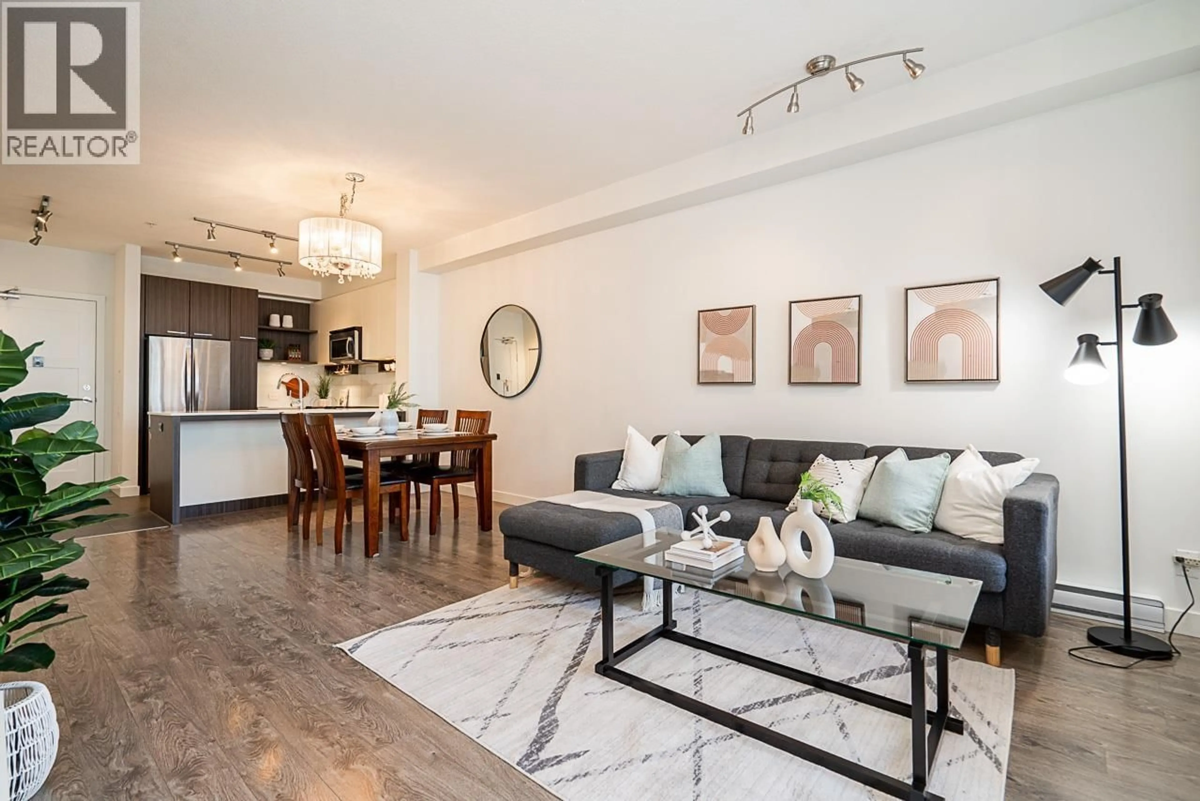 Living room with furniture, wood/laminate floor for 313 - 553 FOSTER AVENUE, Coquitlam British Columbia V3J0B5