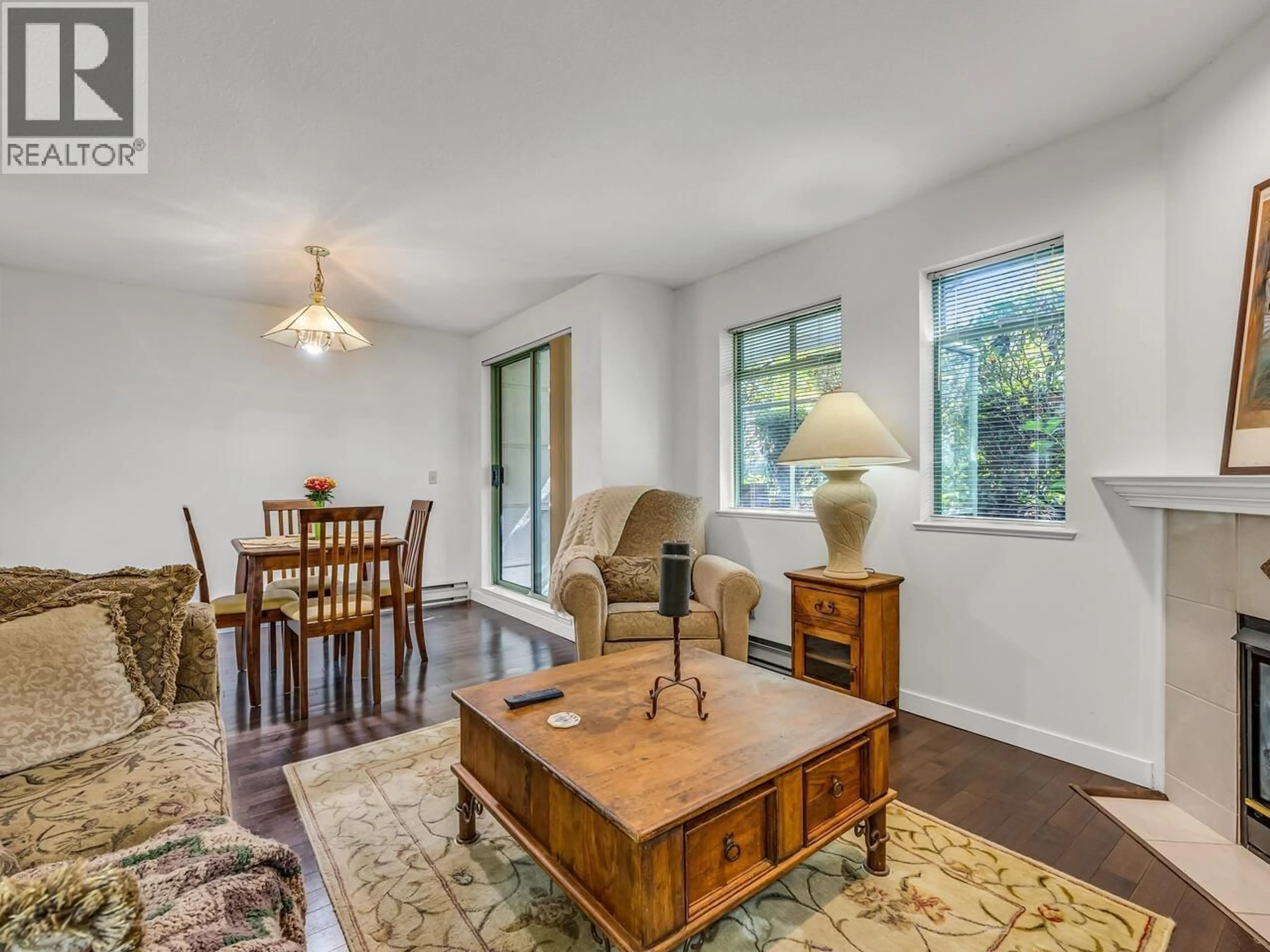 Living room with furniture, wood/laminate floor for 204 - 6735 STATION HILL COURT, Burnaby British Columbia V3N4W5