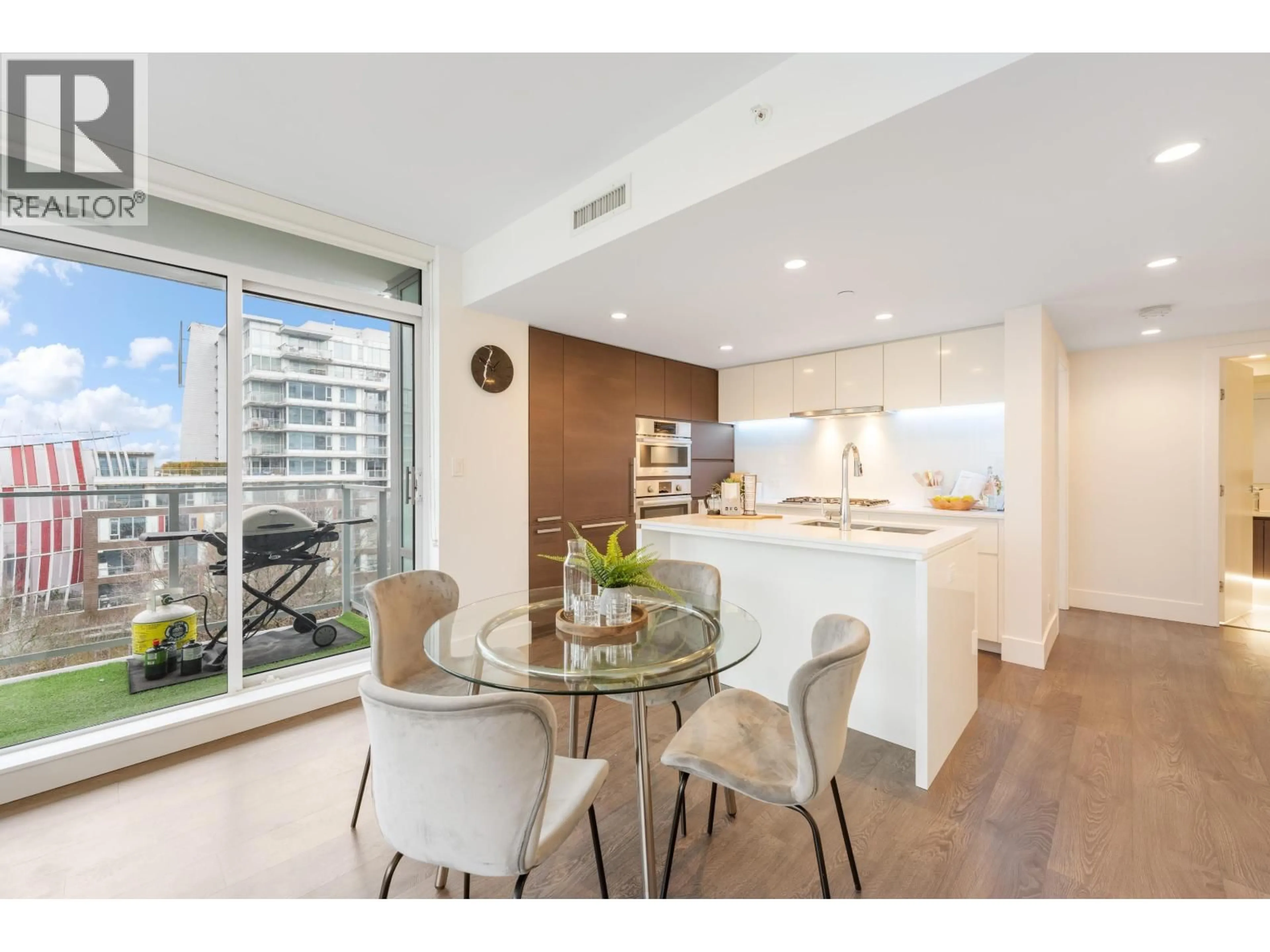 Open concept kitchen, wood/laminate floor for 703 - 5508 HOLLYBRIDGE WAY, Richmond British Columbia V7C0C7