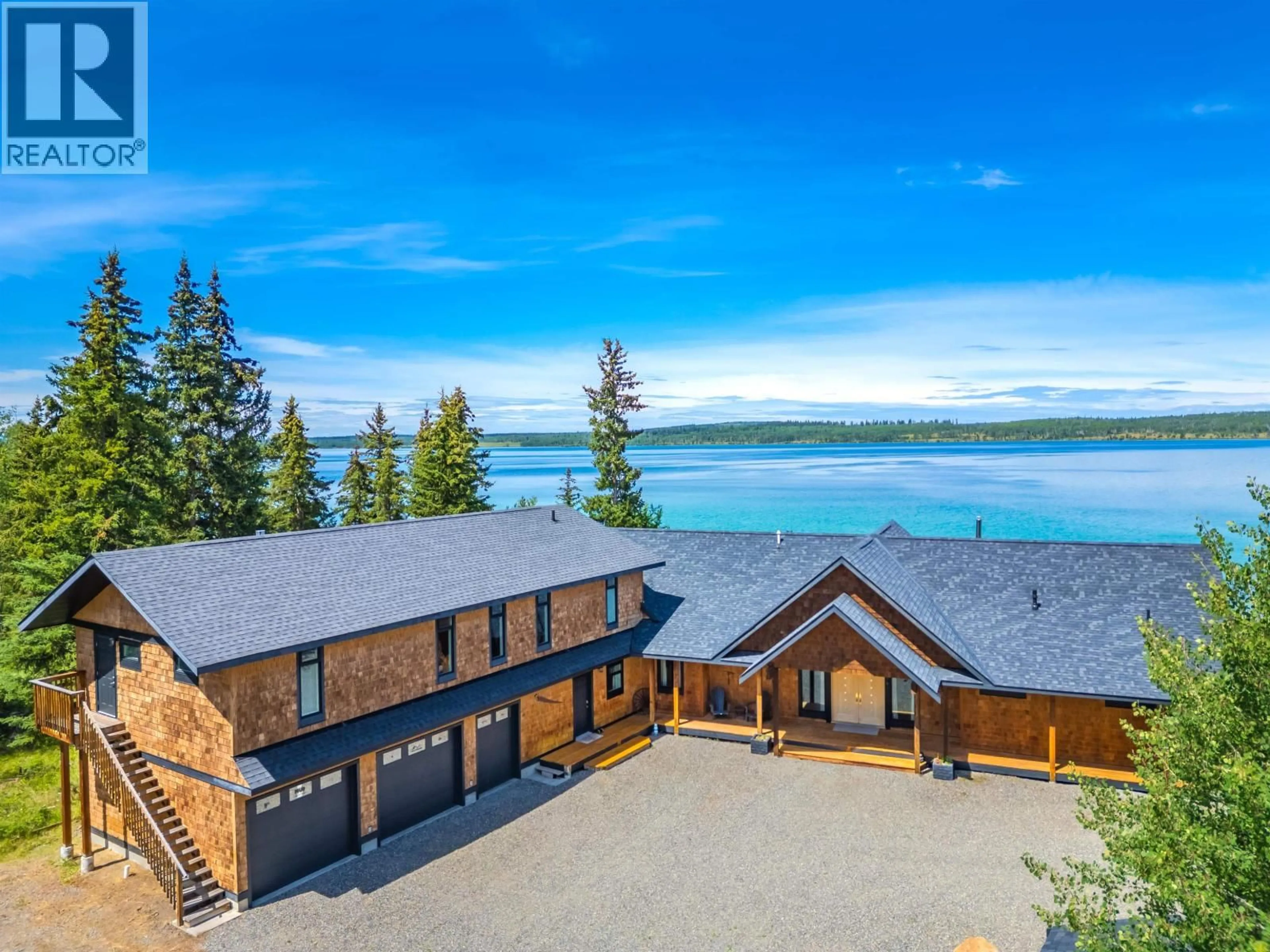 A pic from outside/outdoor area/front of a property/back of a property/a pic from drone, water/lake/river/ocean view for 1211 GREEN LAKE ROAD, 100 Mile House British Columbia V0K2K0