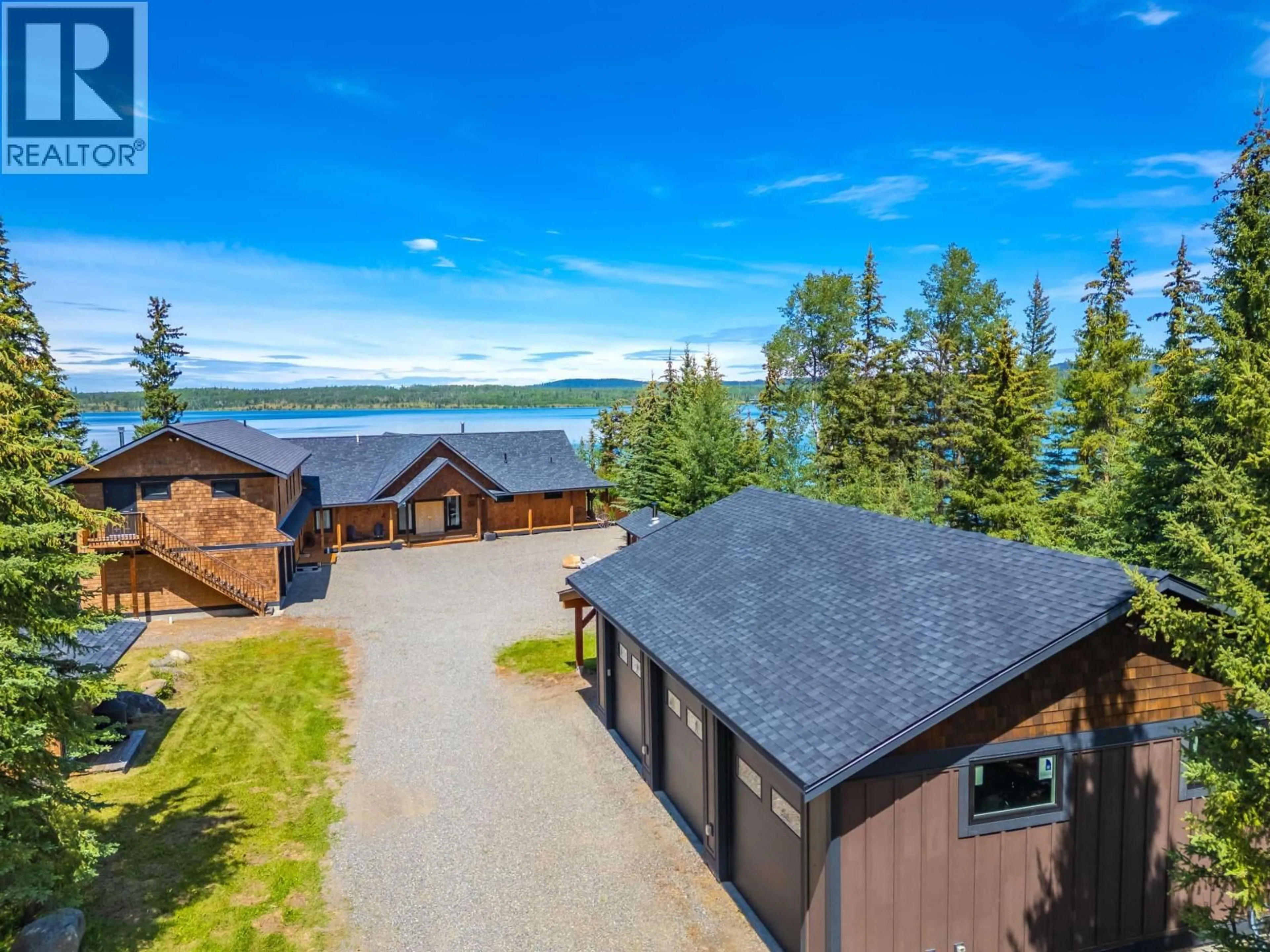 A pic from outside/outdoor area/front of a property/back of a property/a pic from drone, water/lake/river/ocean view for 1211 GREEN LAKE ROAD, 100 Mile House British Columbia V0K2K0