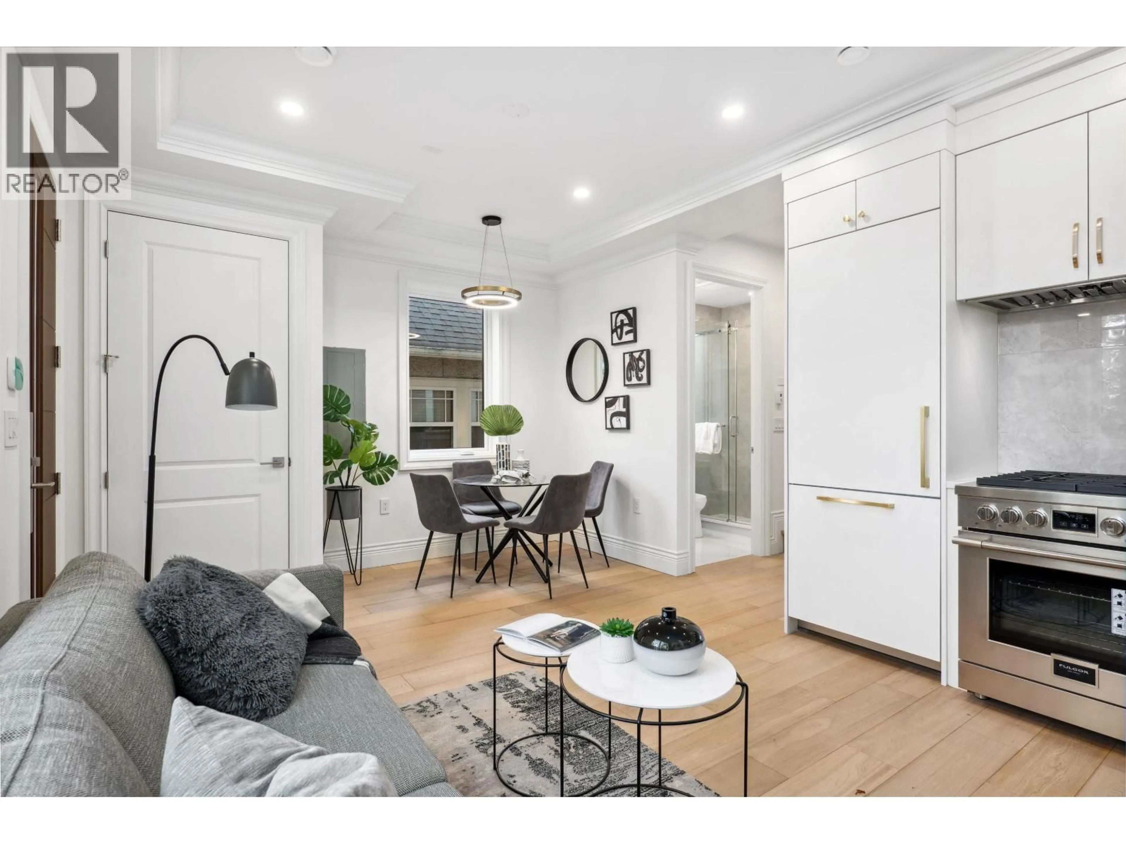 Open concept kitchen, wood/laminate floor for 3812 15TH AVENUE, Vancouver British Columbia V6R2Z9