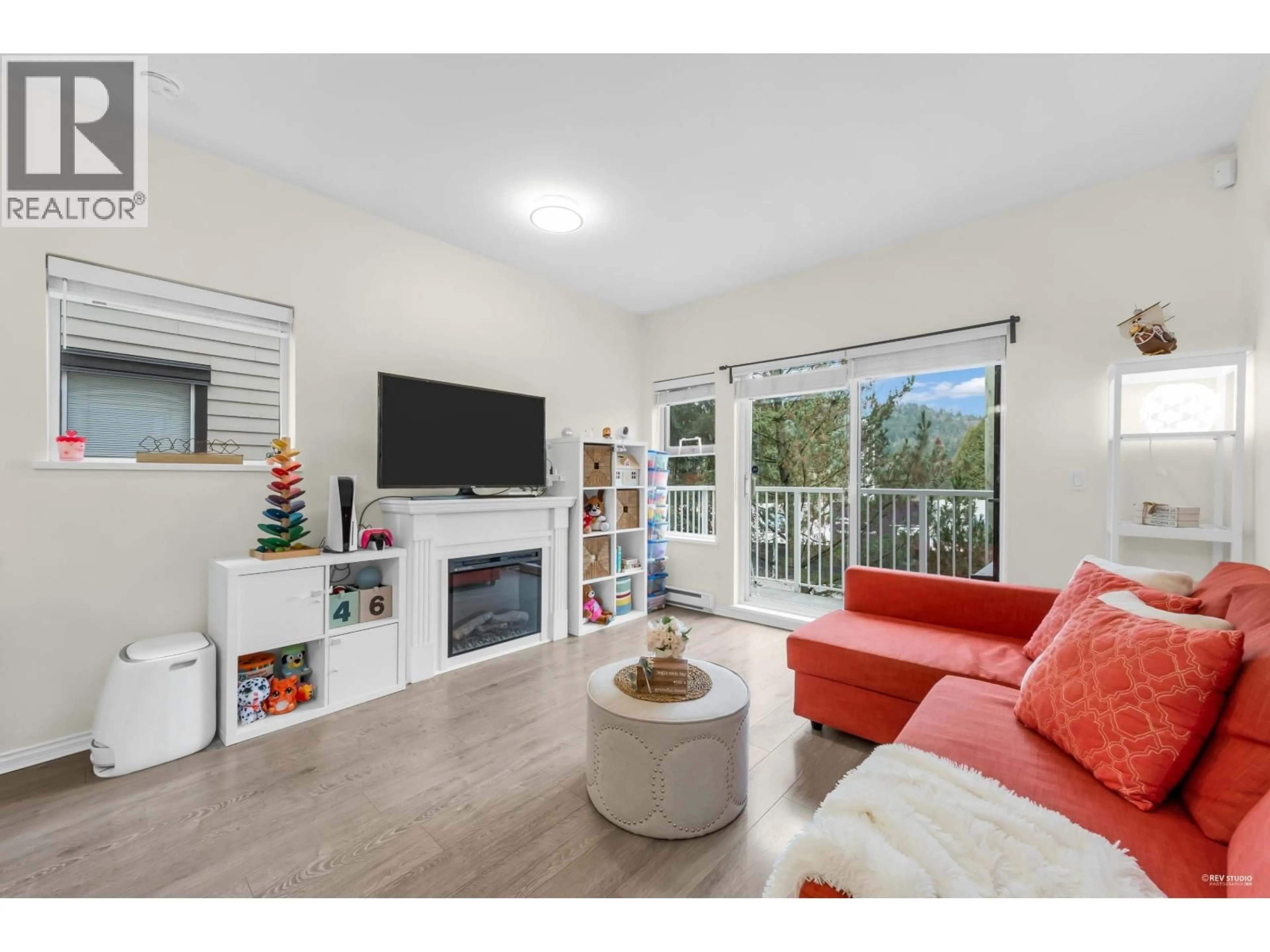 Living room with furniture, wood/laminate floor for 45 - 730 FARROW STREET, Coquitlam British Columbia V3J7Y7