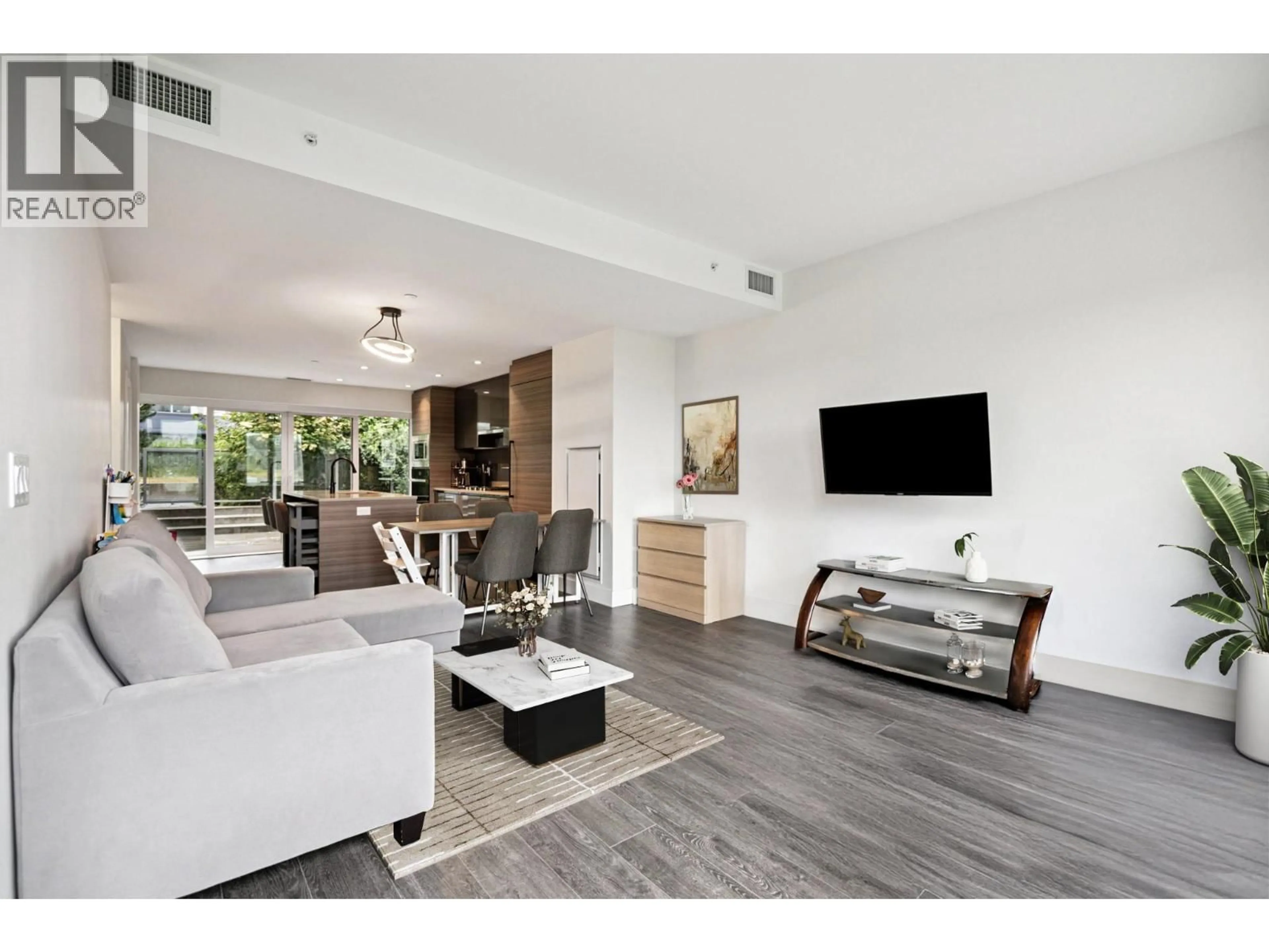 Living room with furniture, wood/laminate floor for 6 - 8589 RIVERGRASS DRIVE, Vancouver British Columbia V5S0J7