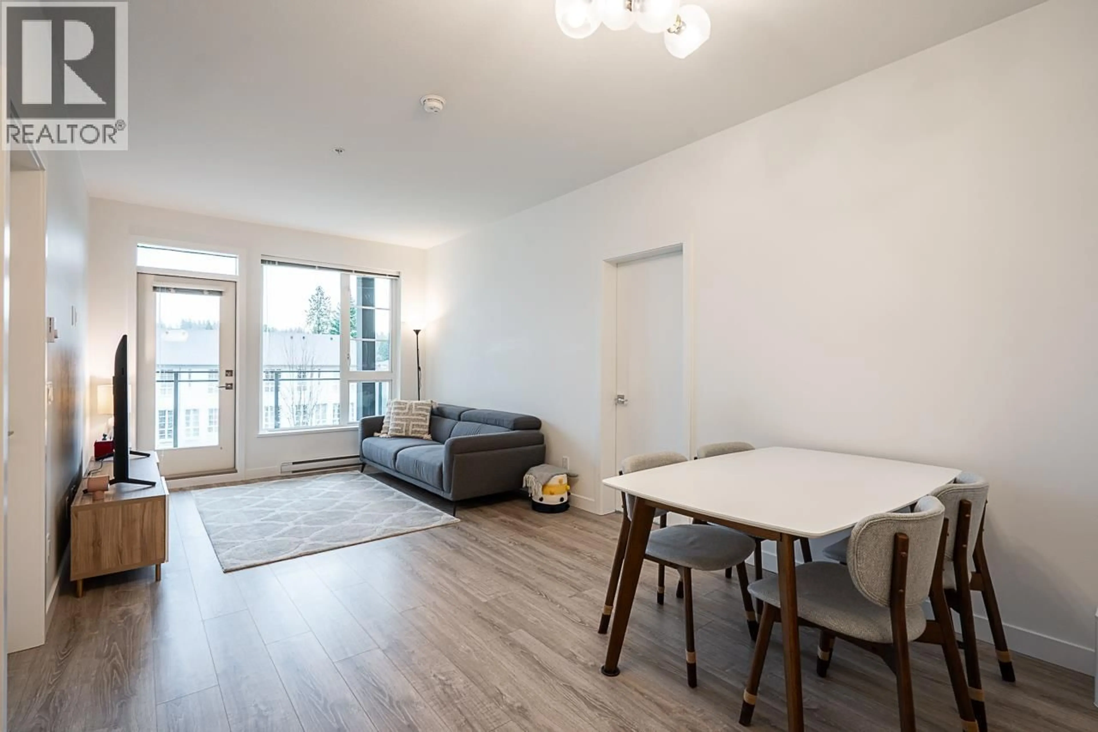 Living room with furniture, wood/laminate floor for 403 - 516 FOSTER AVENUE, Coquitlam British Columbia V3J0H8