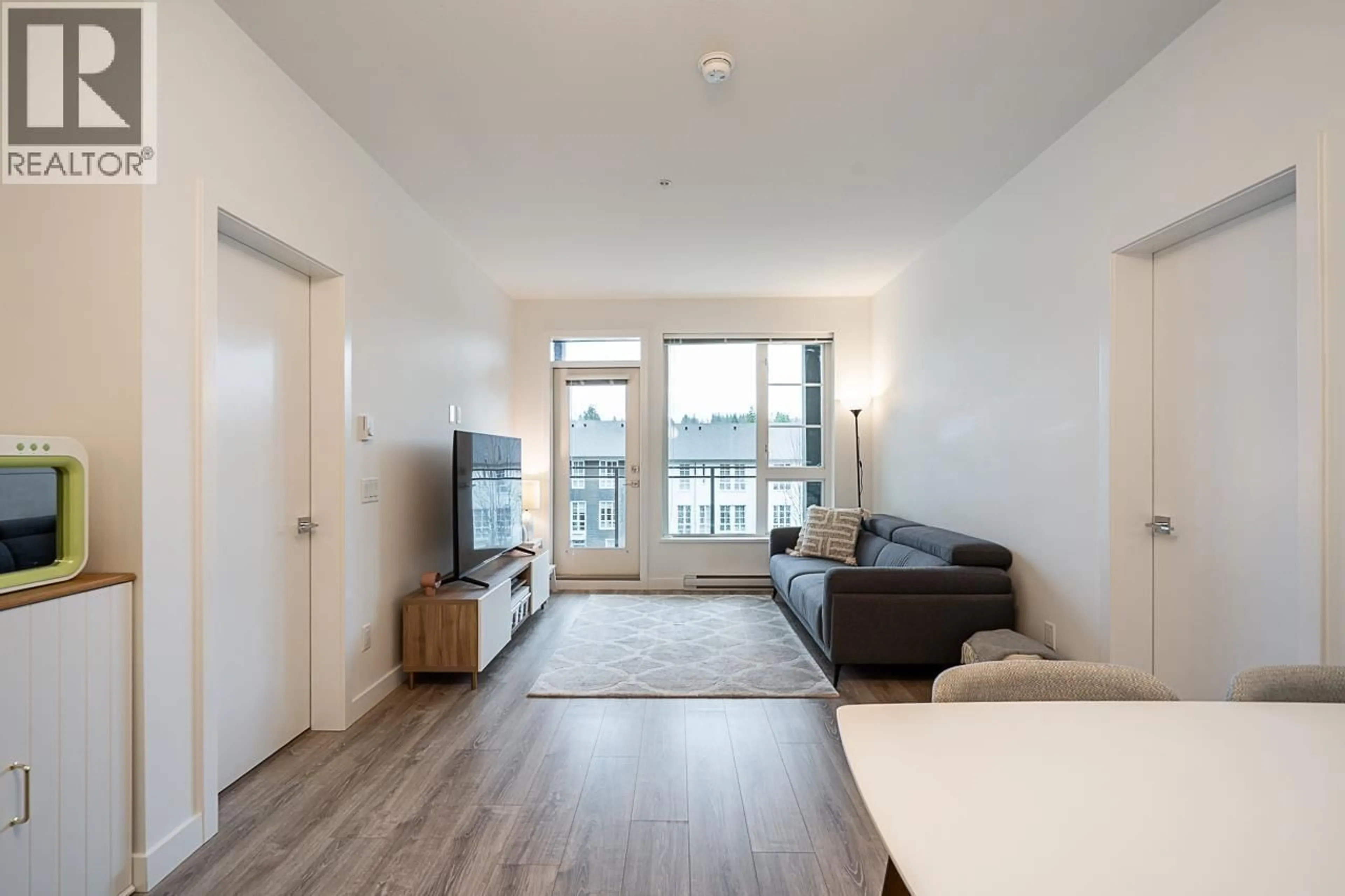 Living room with furniture, wood/laminate floor for 403 - 516 FOSTER AVENUE, Coquitlam British Columbia V3J0H8