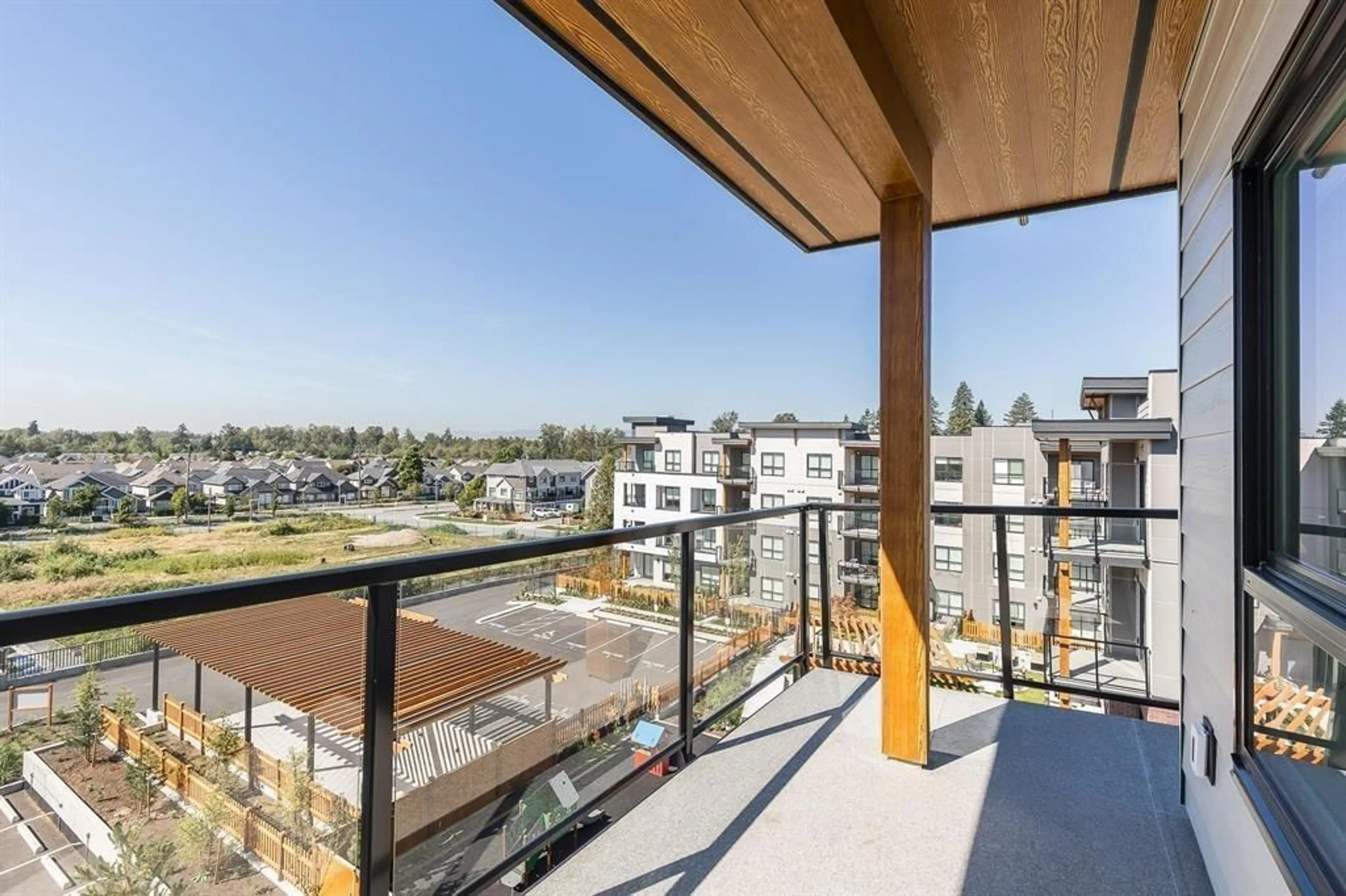 Balcony in the apartment, city buildings view from balcony for 404 - 20286 72B AVENUE, Langley British Columbia V2Y3X4