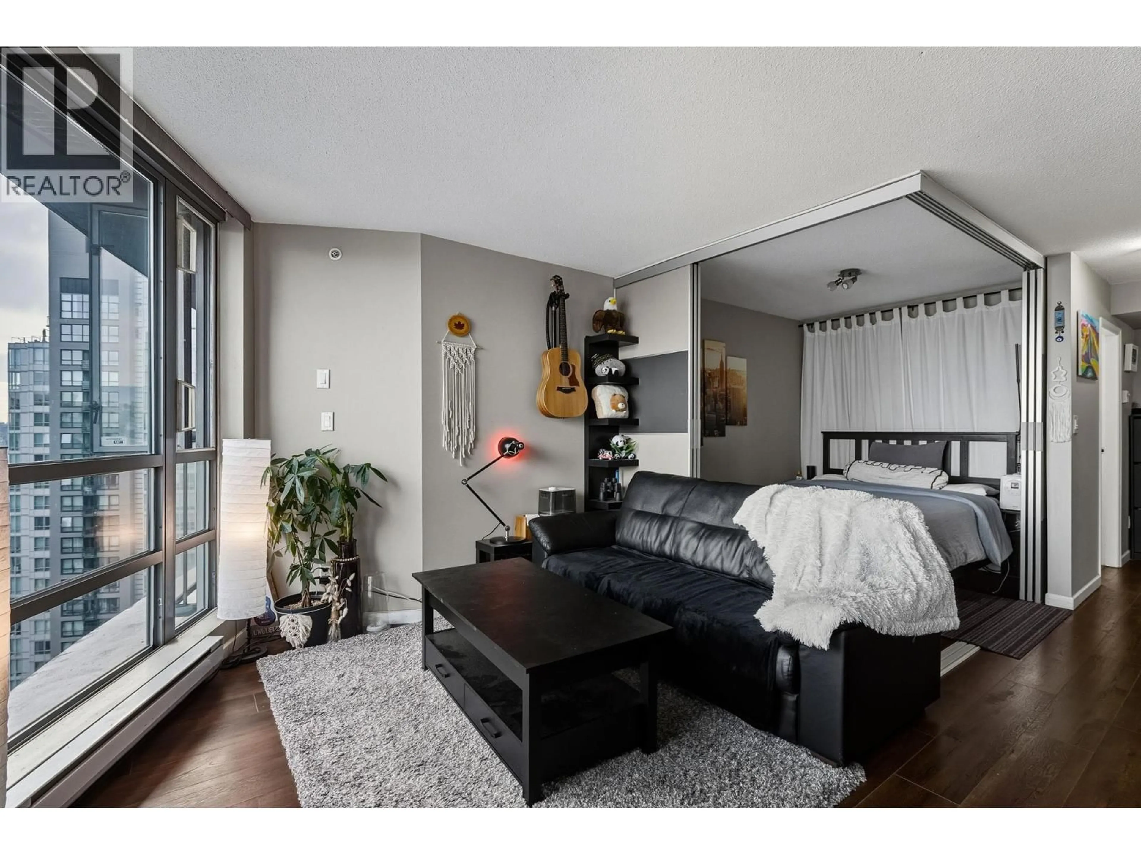 Living room with furniture, wood/laminate floor for 2610 - 501 PACIFIC STREET, Vancouver British Columbia V6Z2X6