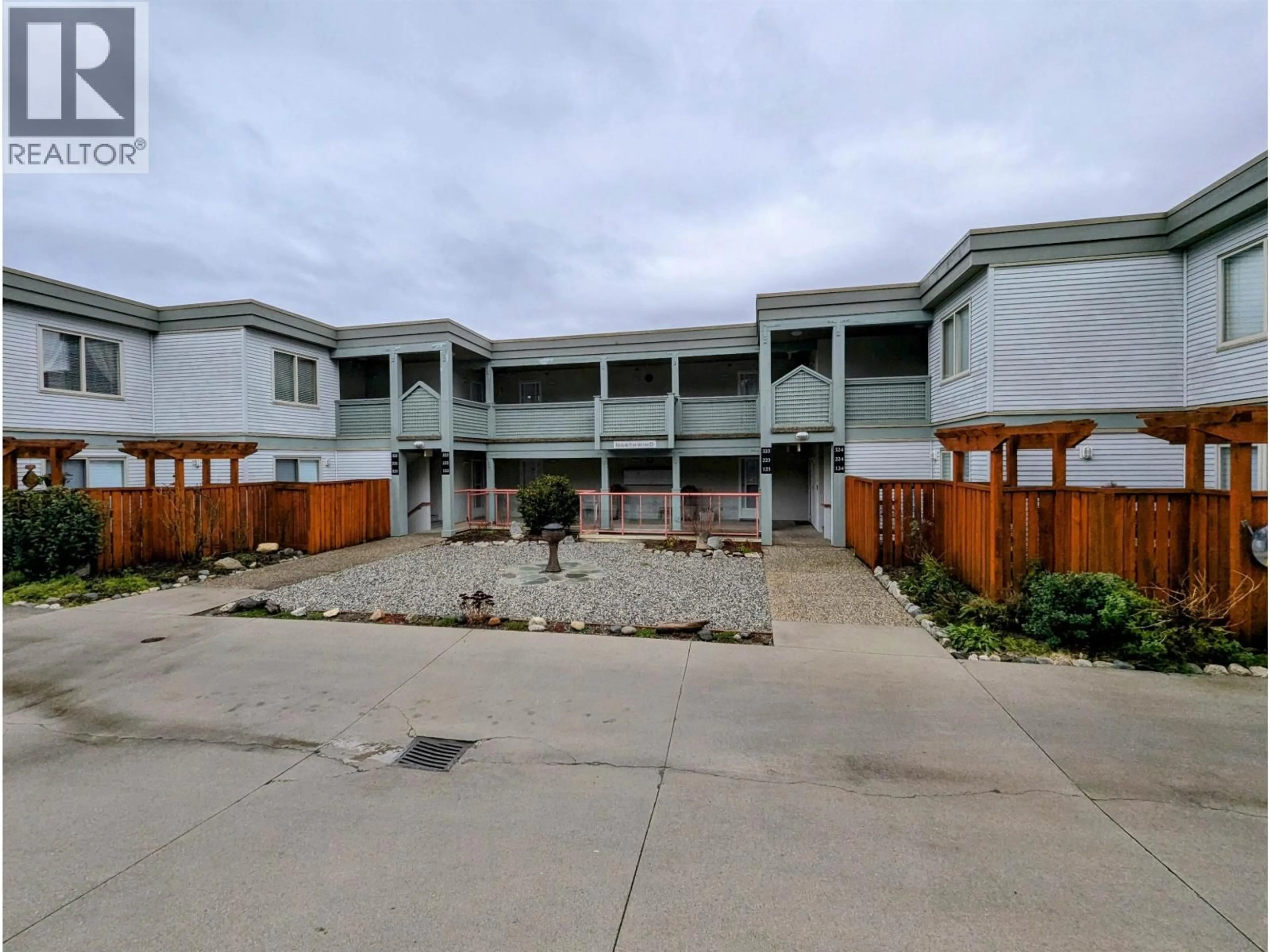 A pic from outside/outdoor area/front of a property/back of a property/a pic from drone, building for 322 - 5780 TRAIL AVENUE, Sechelt British Columbia V7Z0K5