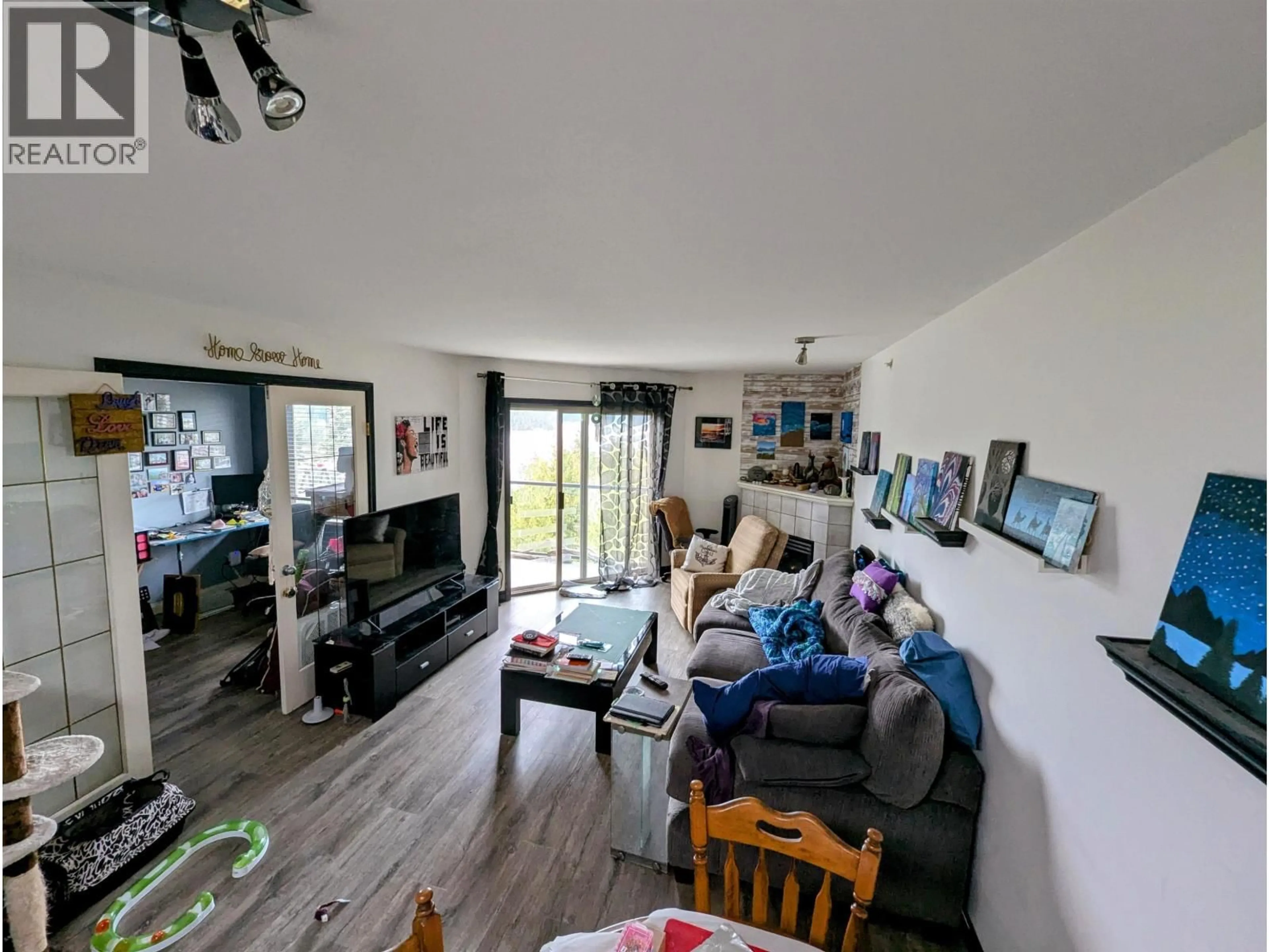 Living room with furniture, wood/laminate floor for 322 - 5780 TRAIL AVENUE, Sechelt British Columbia V7Z0K5