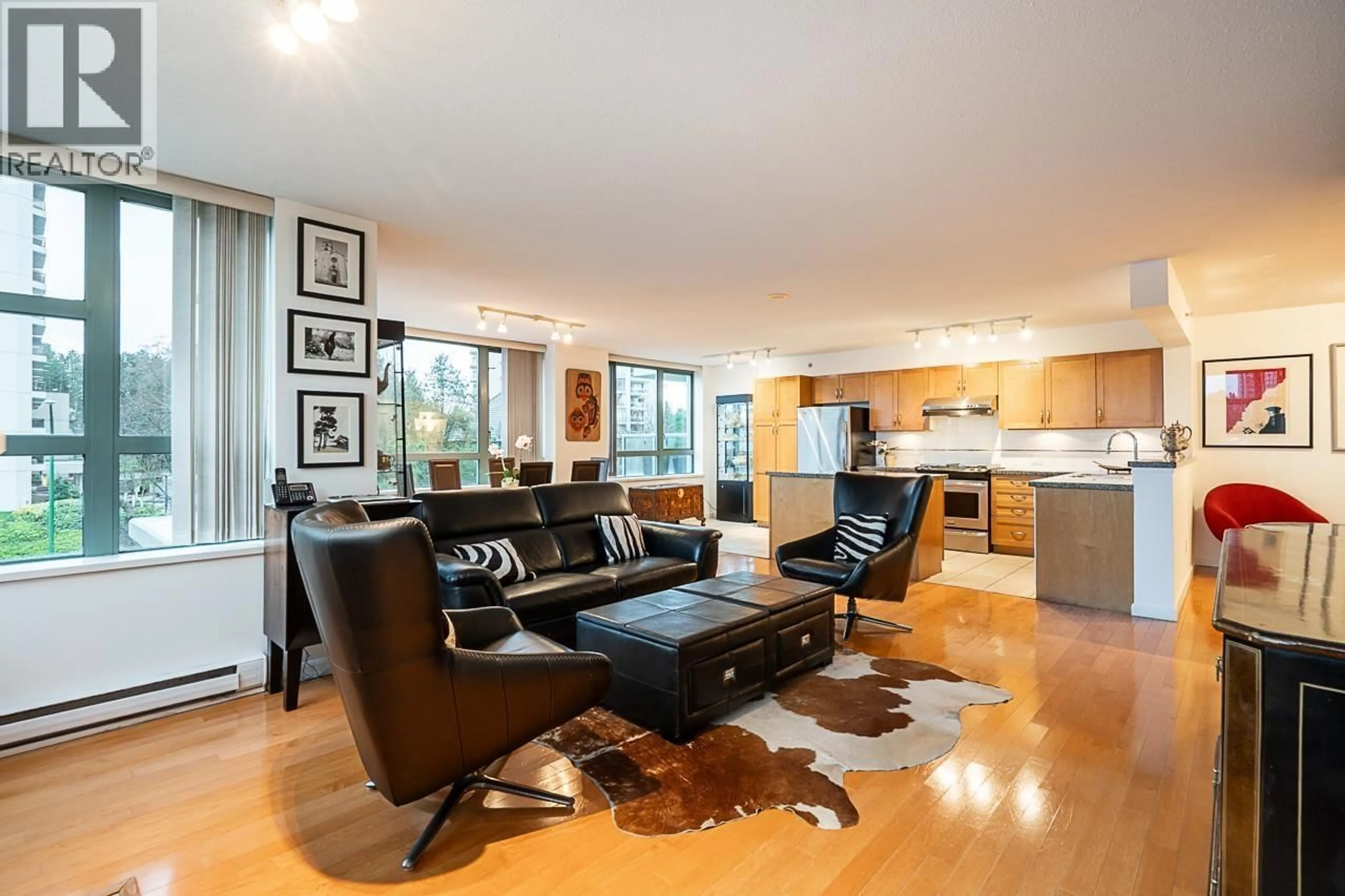 Living room with furniture, wood/laminate floor for 304 - 4380 HALIFAX STREET, Burnaby British Columbia V5C6R3