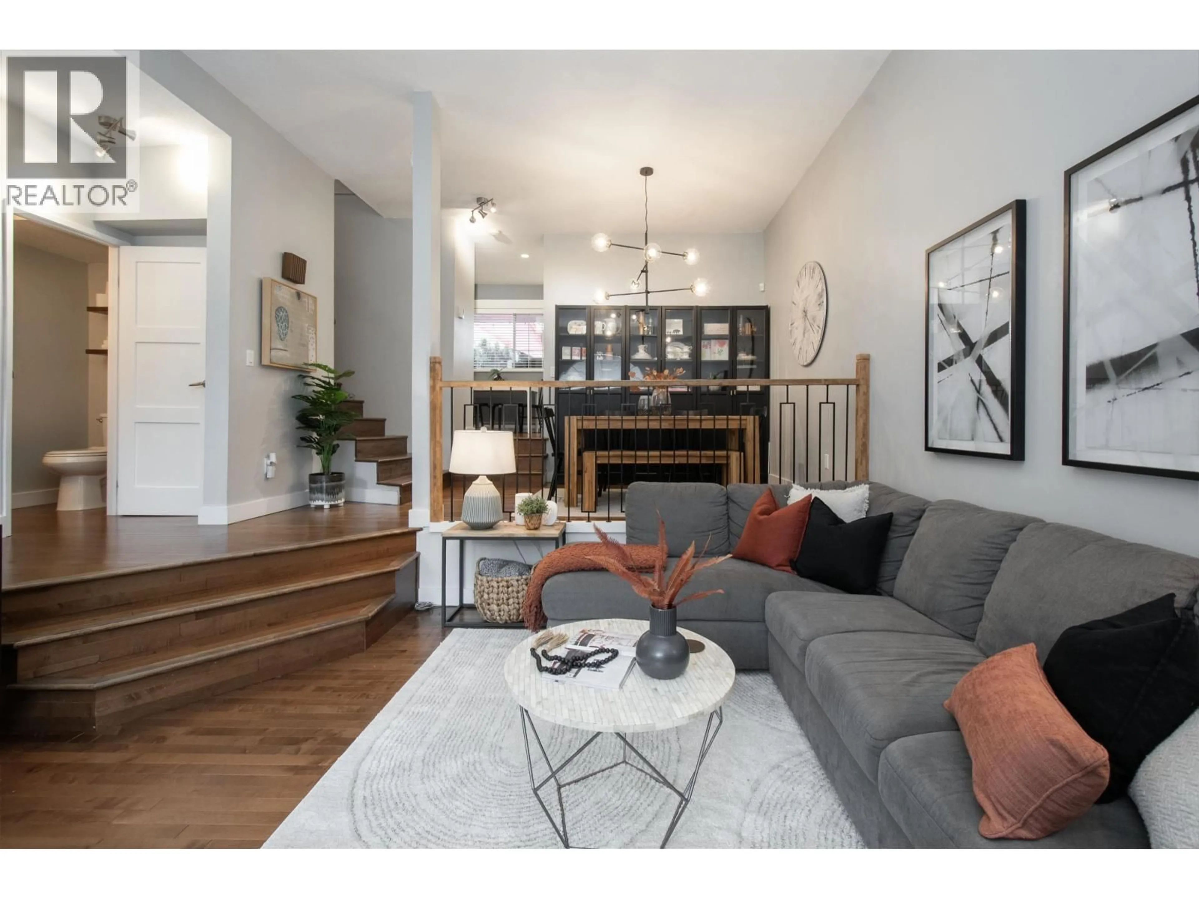 Living room with furniture, wood/laminate floor for 118 - 216 6TH STREET, North Vancouver British Columbia V7L1P5